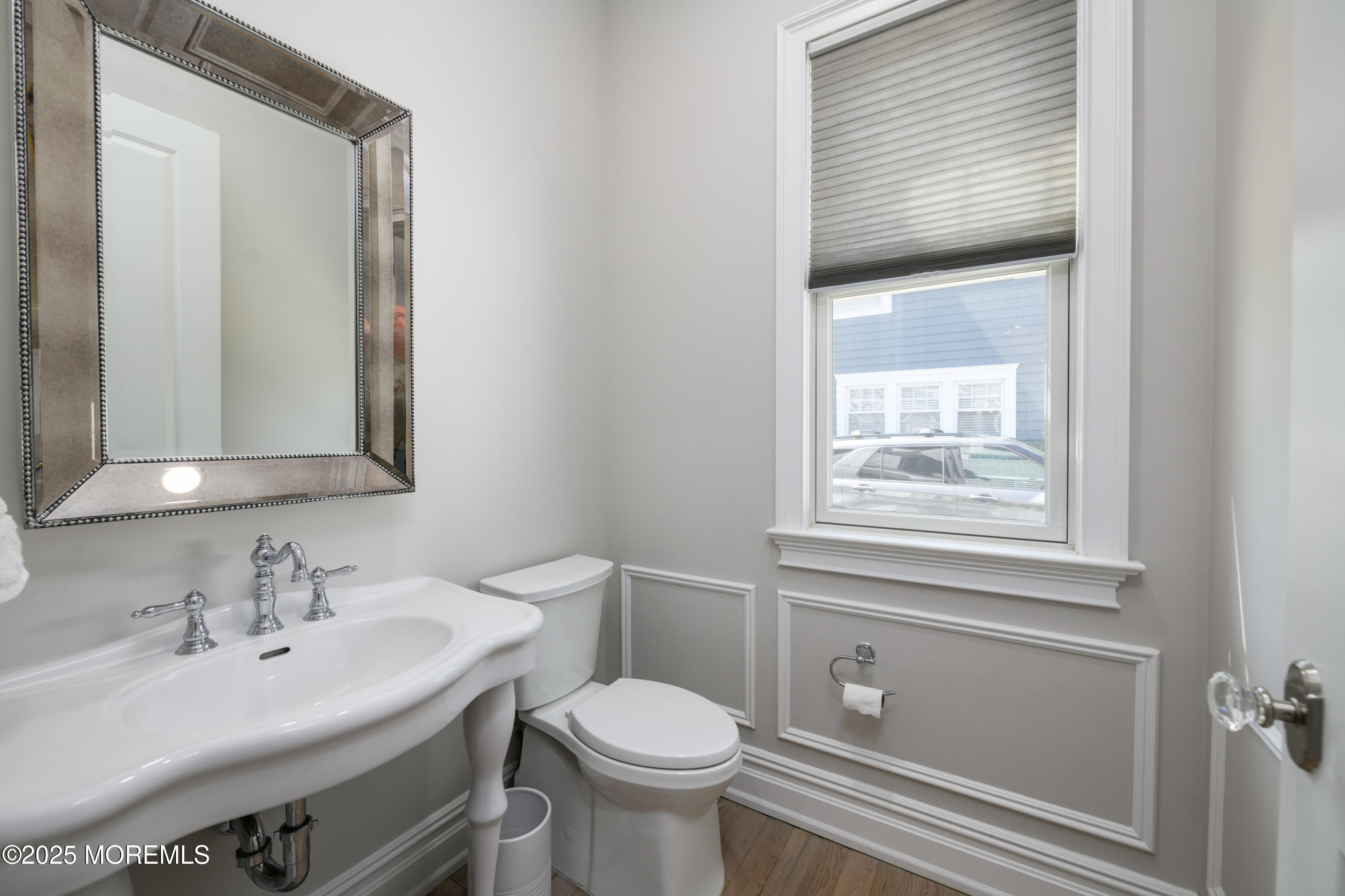 98 Harvard Road Fair Haven, NJ 07704 - Photo 37 of 51 a bathroom with a toilet sink and mirror
