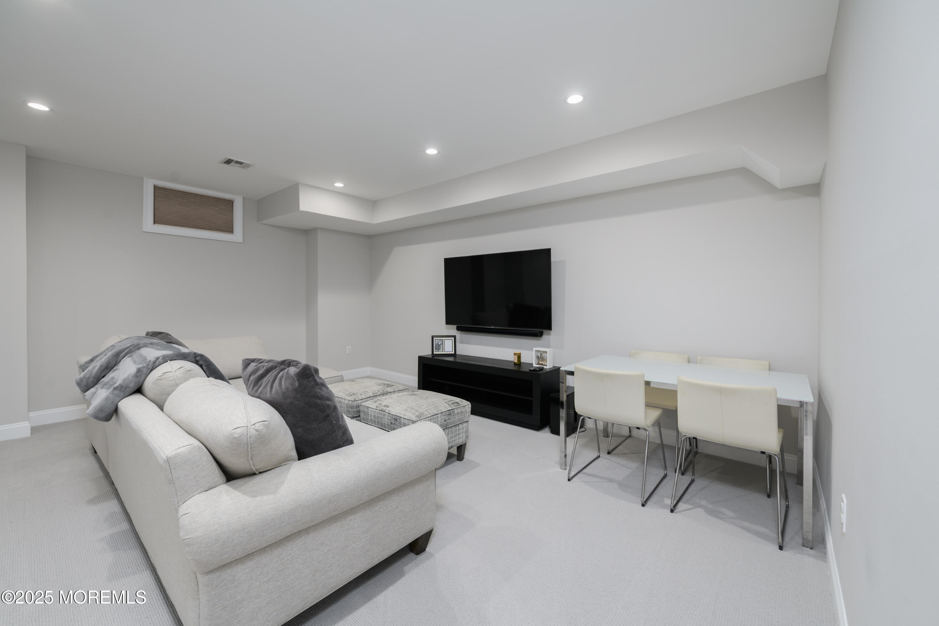 98 Harvard Road Fair Haven, NJ 07704 - Photo 38 of 51 a living room with furniture and a flat screen tv