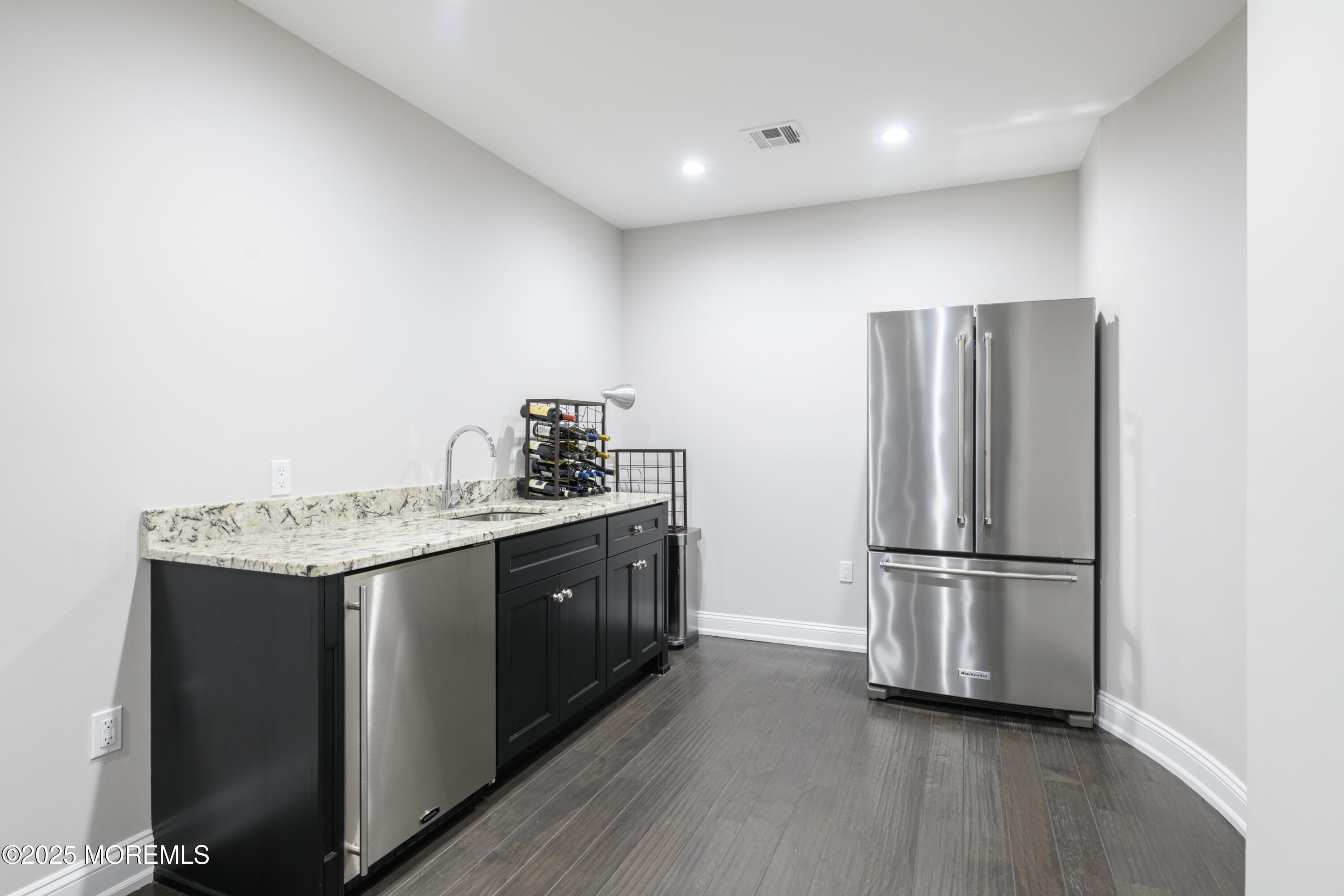 98 Harvard Road Fair Haven, NJ 07704 - Photo 39 of 51 a kitchen with stainless steel appliances granite countertop a refrigerator and a stove top oven