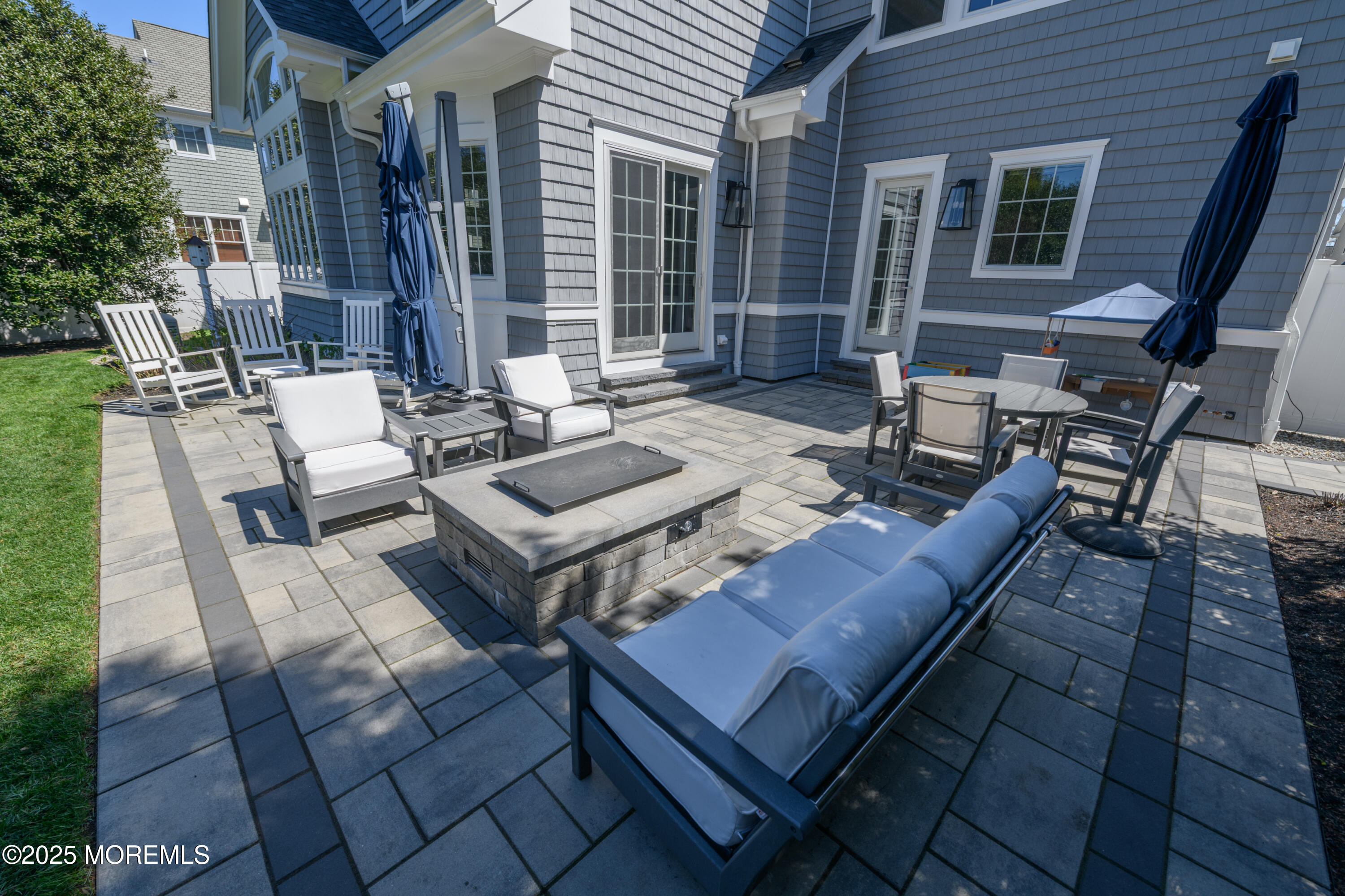 98 Harvard Road Fair Haven, NJ 07704 - Photo 4 of 51 a view of a patio with couches and table and chairs with wooden floor and fence