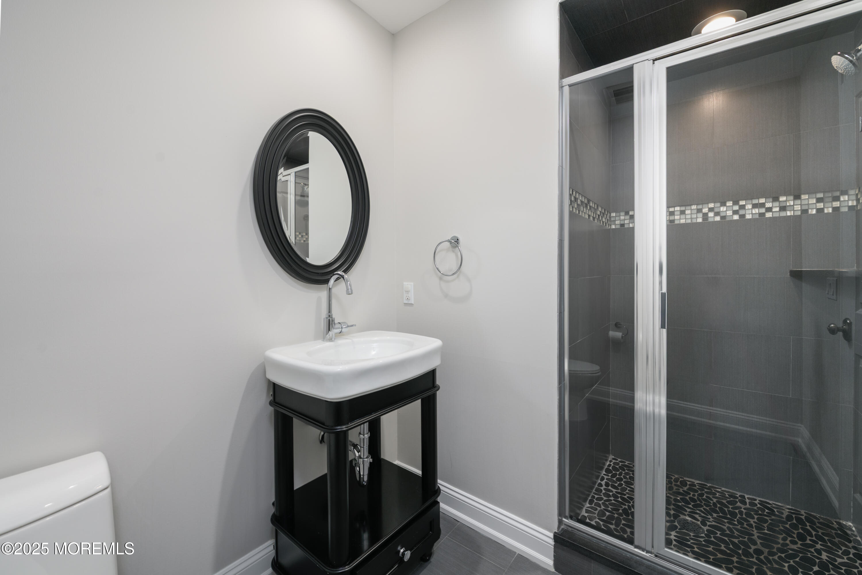 98 Harvard Road Fair Haven, NJ 07704 - Photo 41 of 51 a bathroom with a sink a toilet and a mirror