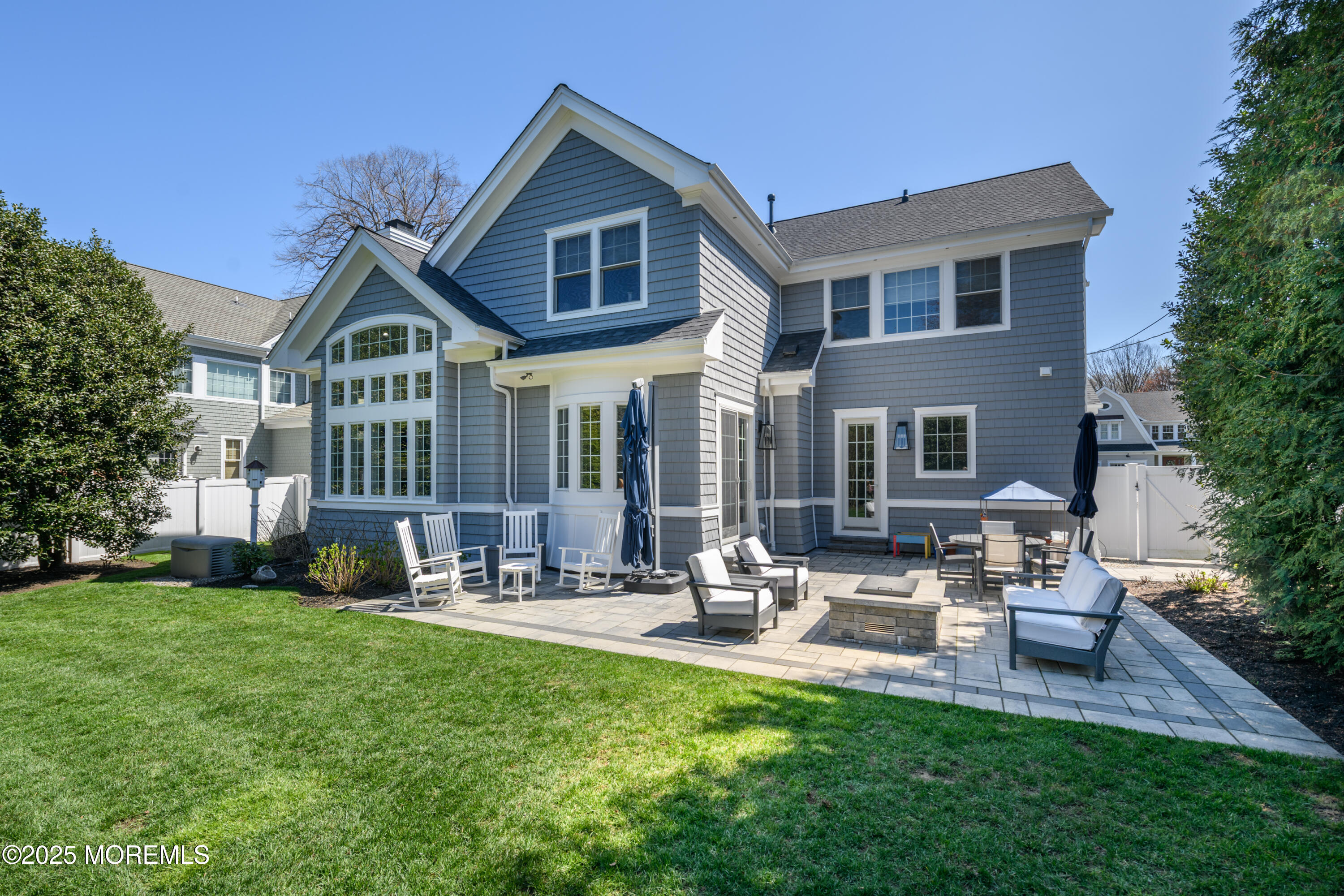98 Harvard Road Fair Haven, NJ 07704 - Photo 43 of 51 a front view of a house with garden and sitting area