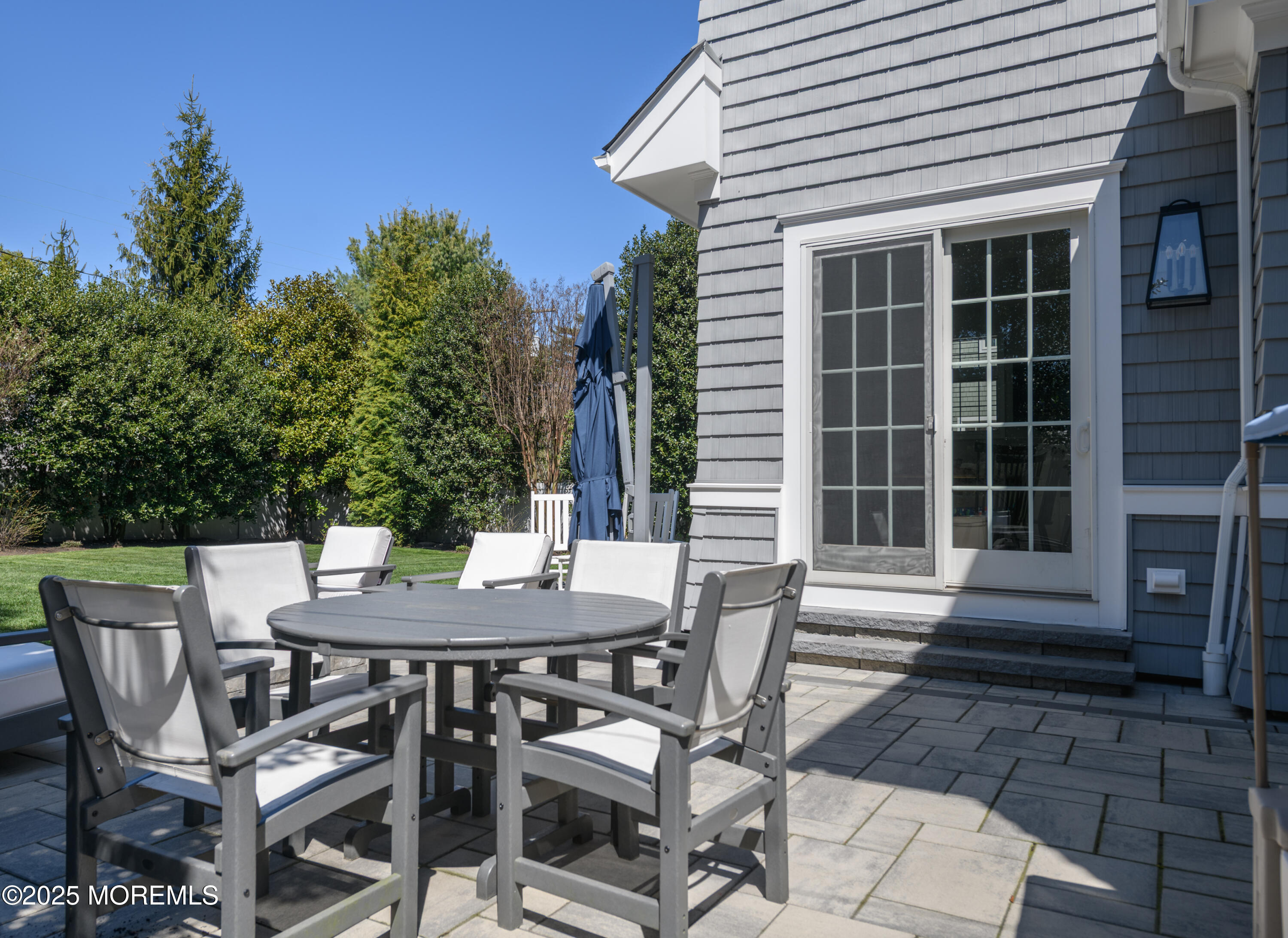 98 Harvard Road Fair Haven, NJ 07704 - Photo 44 of 51 a view of a patio with a table and chairs