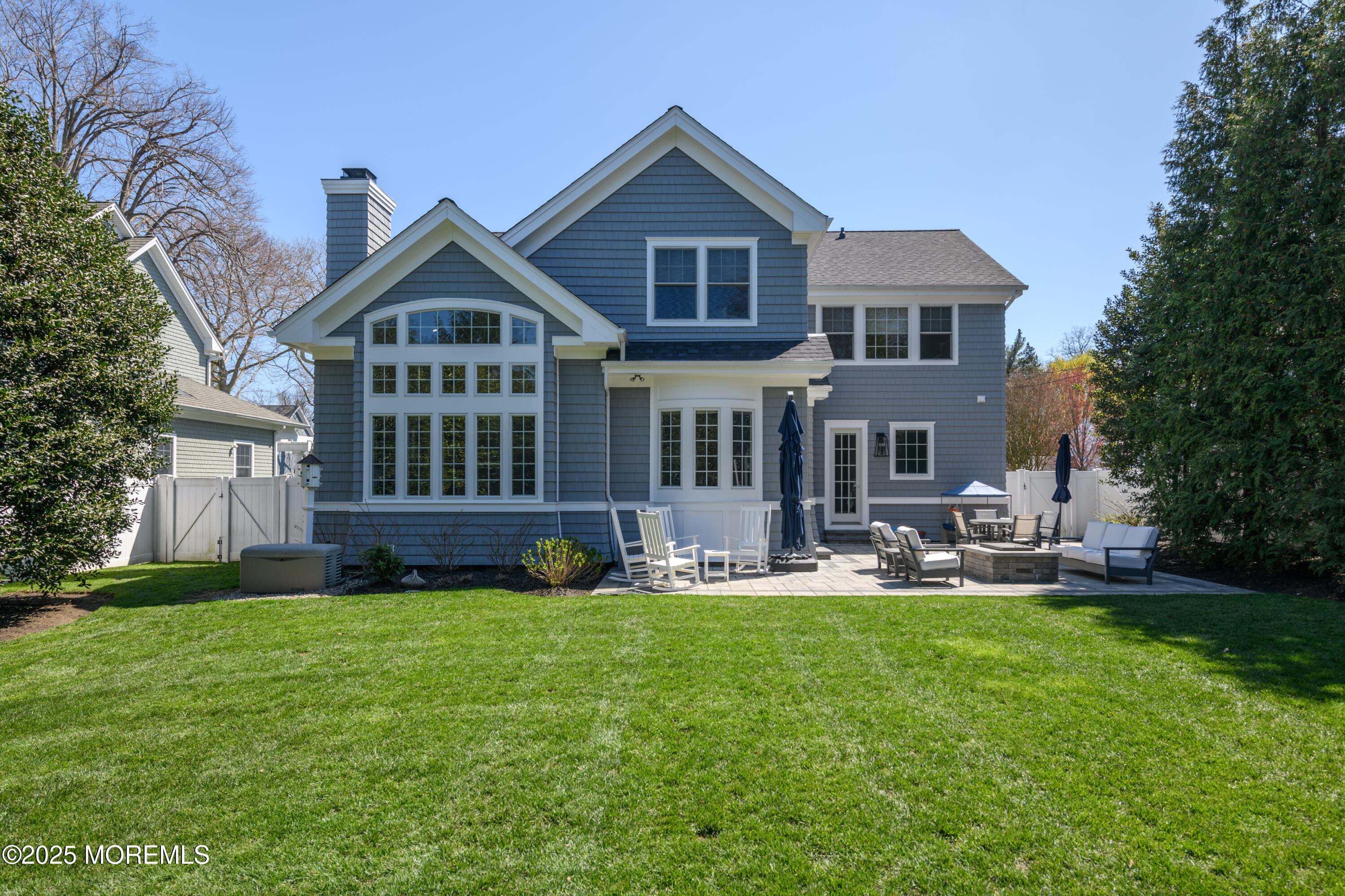 98 Harvard Road Fair Haven, NJ 07704 - Photo 47 of 51 a front view of a house with a yard and patio