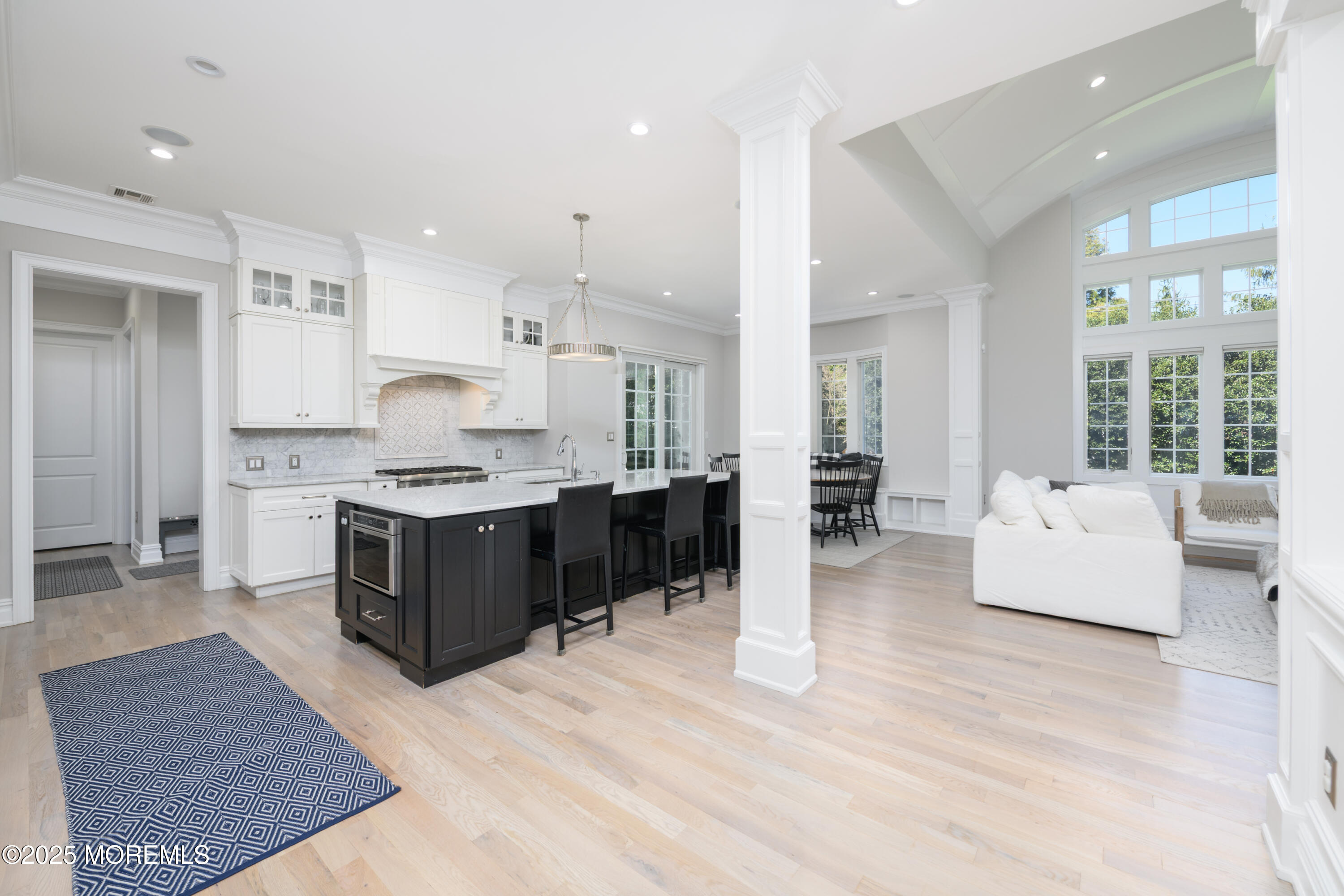 98 Harvard Road Fair Haven, NJ 07704 - Photo 8 of 51 a large white kitchen with a large window and stainless steel appliances