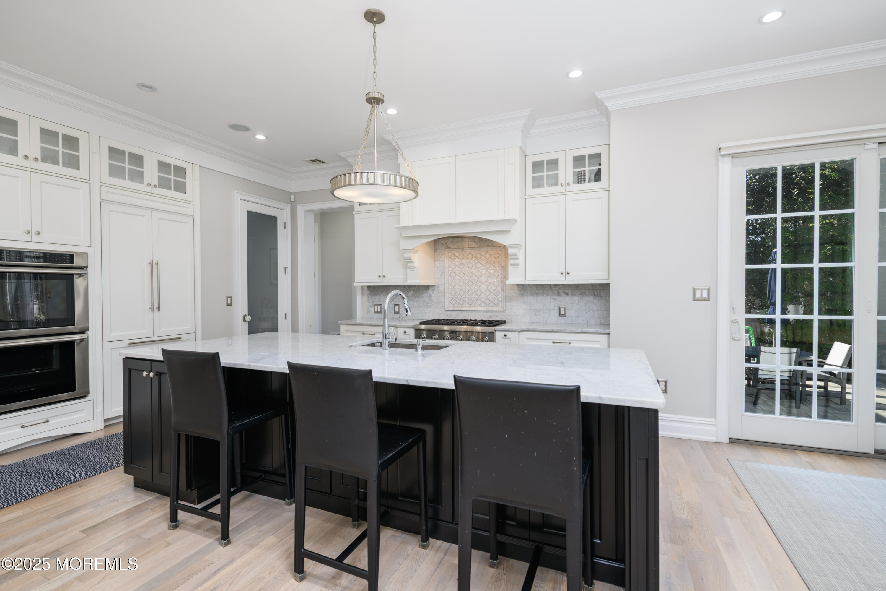 98 Harvard Road Fair Haven, NJ 07704 - Photo 9 of 51 a kitchen with stainless steel appliances granite countertop a sink a stove a refrigerator and island with wooden floor