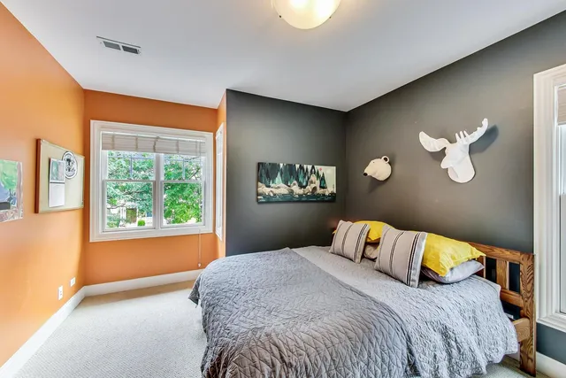 a bedroom with a bed and dresser