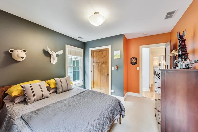 a bedroom with a bed and a couch