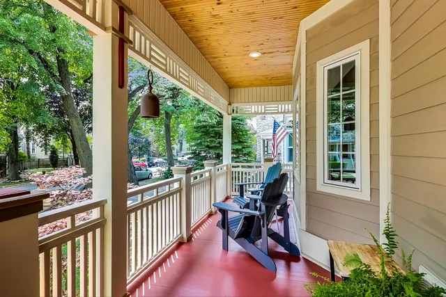 a view of a porch with furniture and backyard