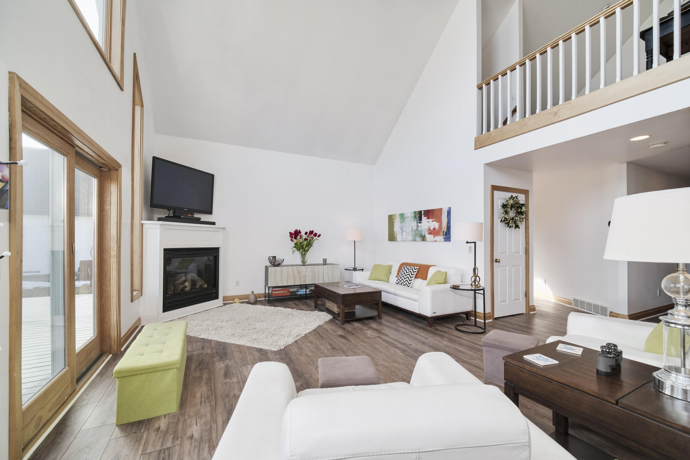 8579 Bayview Road Onekama, MI 49675 - Photo 18 of 72 Living room with loft above