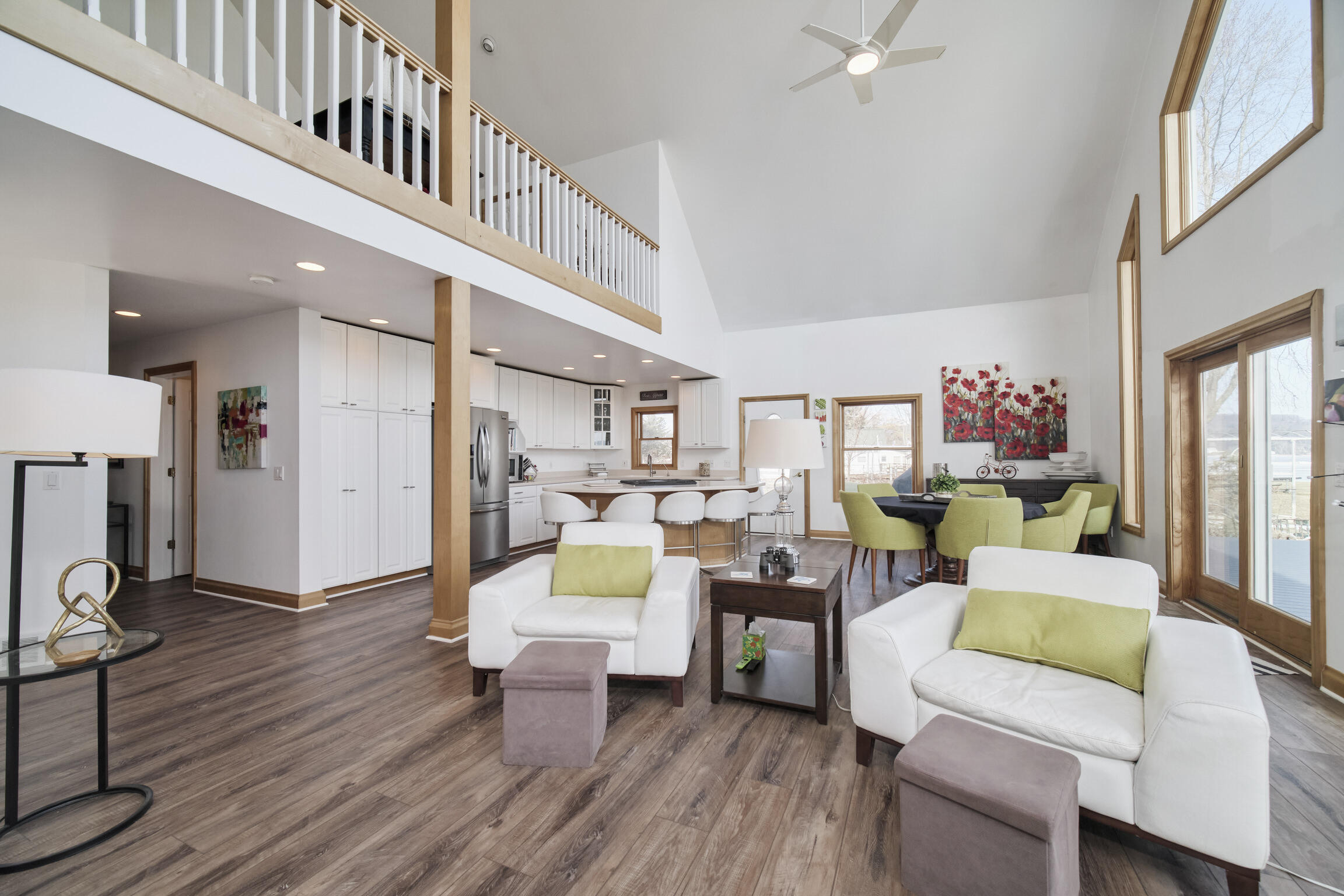 8579 Bayview Road Onekama, MI 49675 - Photo 23 of 72 Living room opens to kitchen and dining