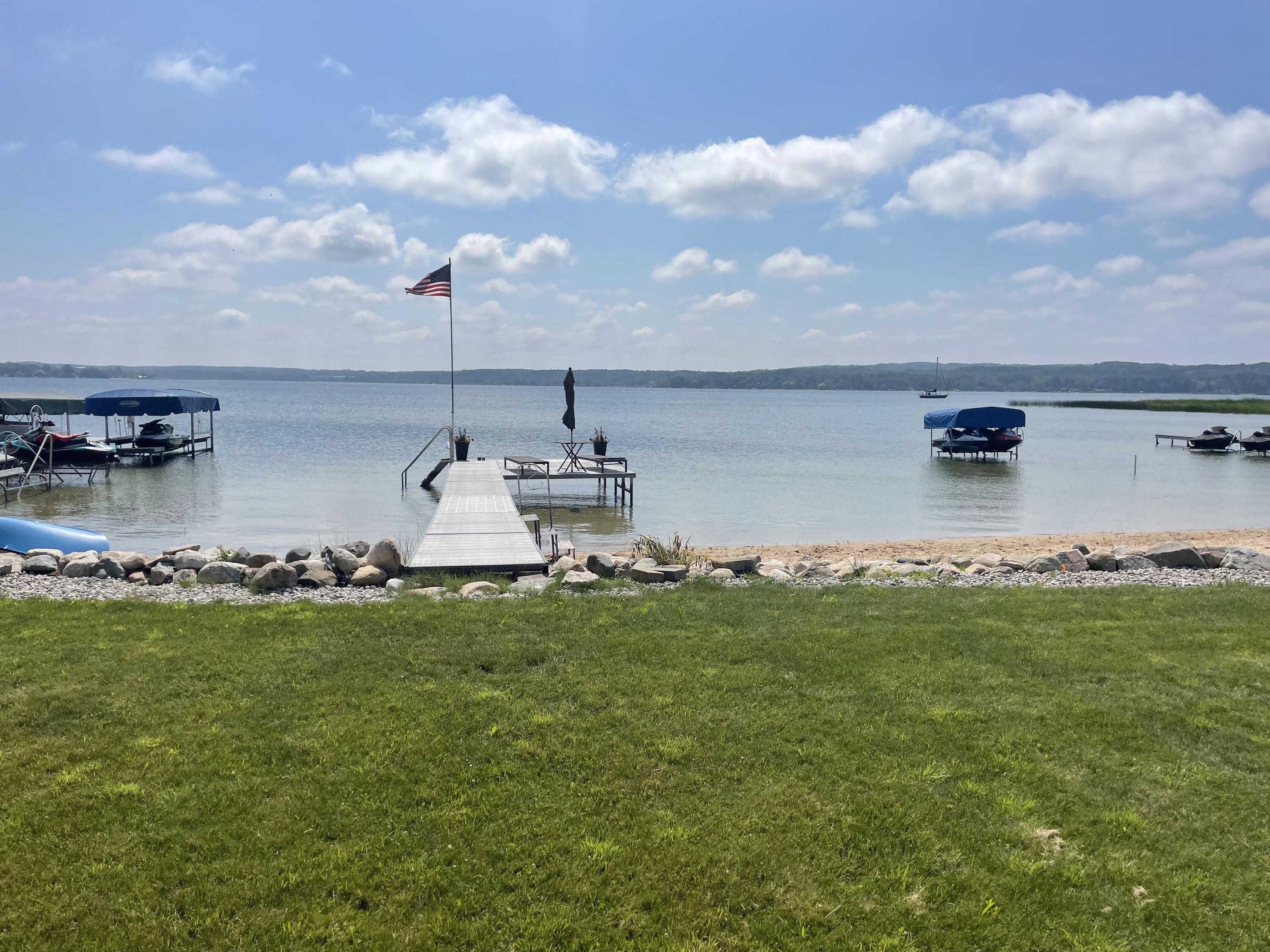 8579 Bayview Road Onekama, MI 49675 - Photo 4 of 72 Beach and dock area