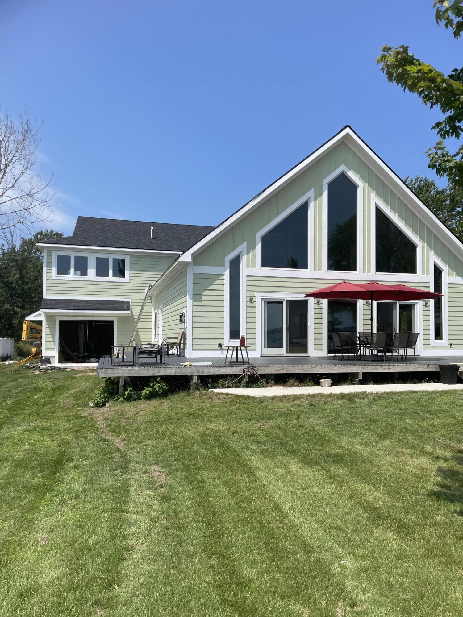 8579 Bayview Road Onekama, MI 49675 - Photo 9 of 72 Front view showing addition