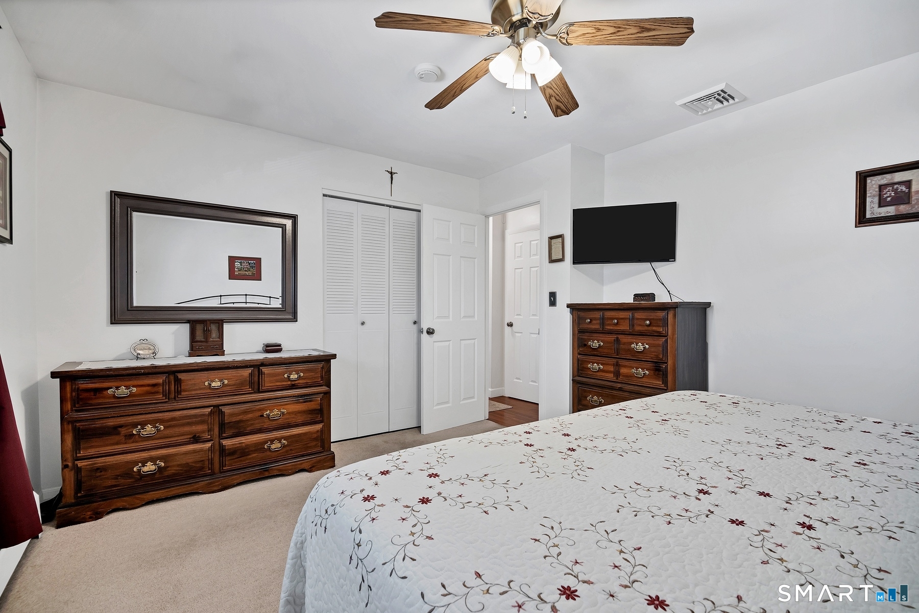 110 Meadow Lark Road Naugatuck, CT 06770 - Photo 11 of 40 a bedroom with a bed and a flat screen tv