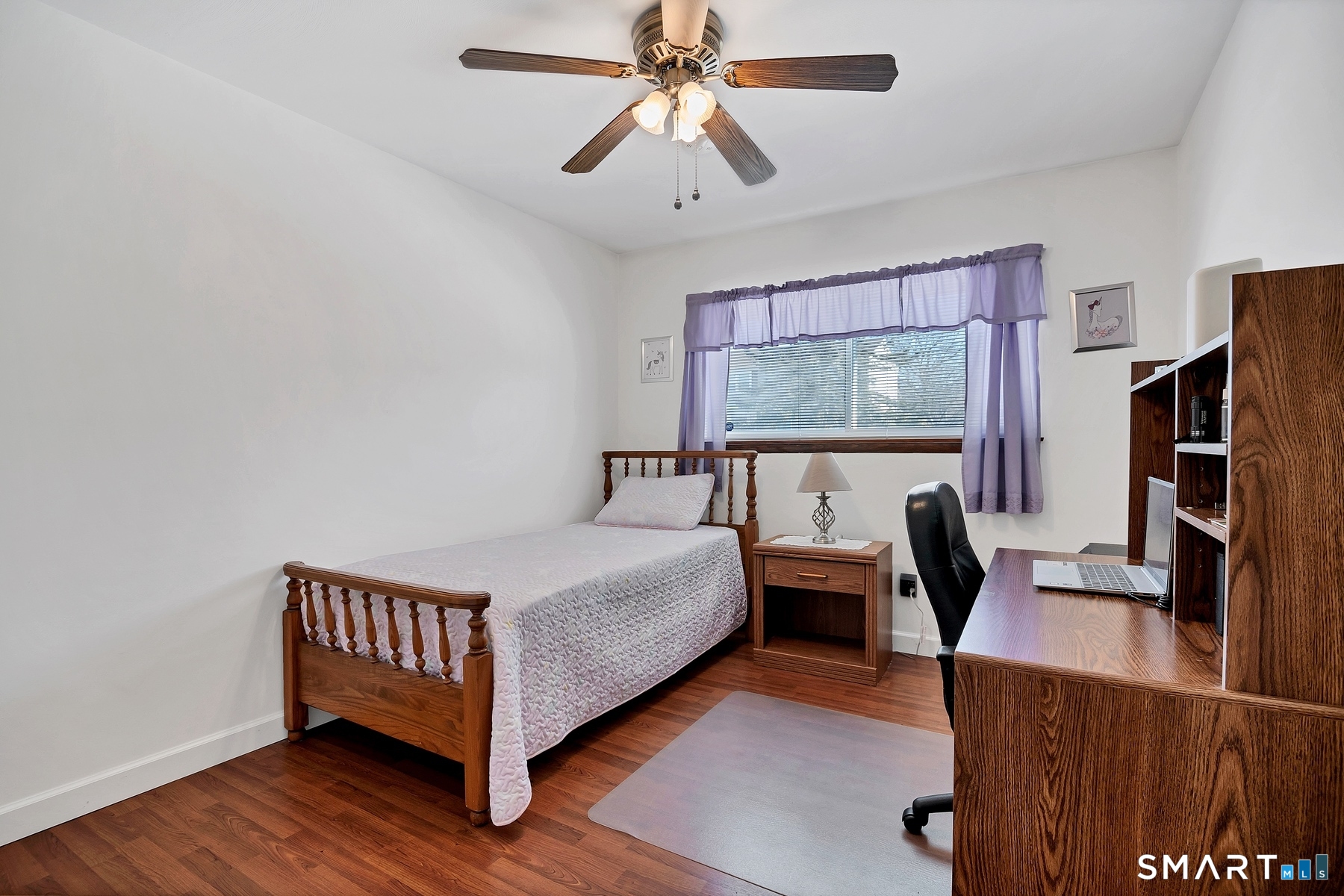 110 Meadow Lark Road Naugatuck, CT 06770 - Photo 12 of 40 a bed room with a bed and a chandelier