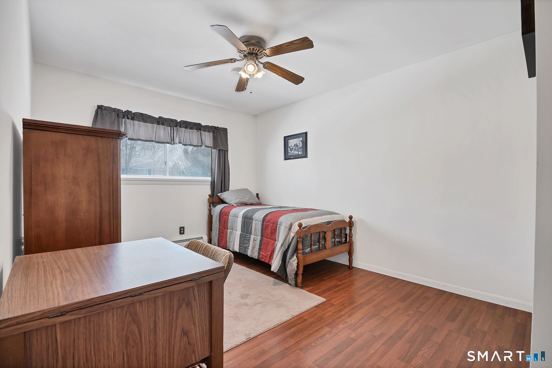 110 Meadow Lark Road Naugatuck, CT 06770 - Photo 14 of 40 a bedroom with a bed and a chandelier