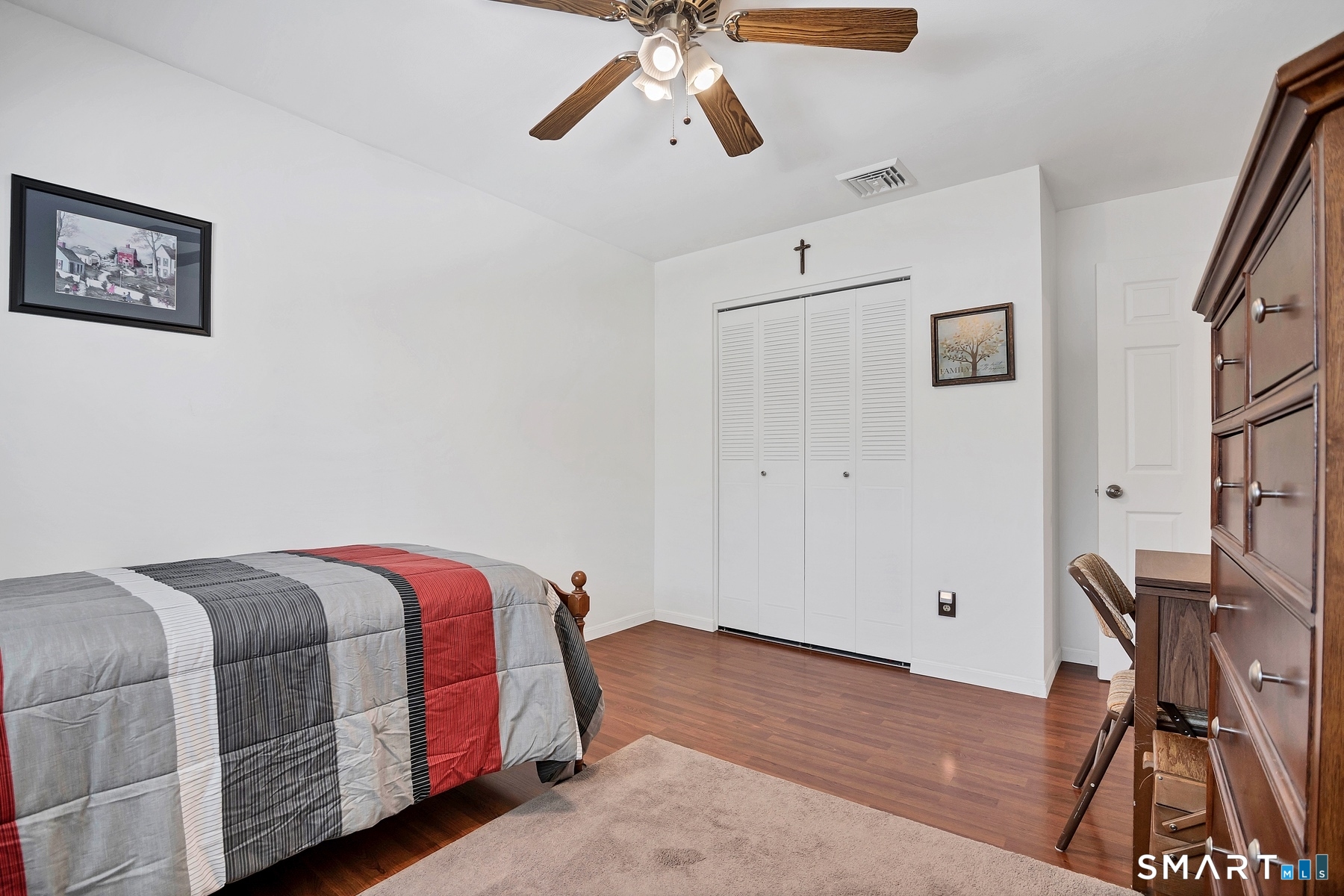 110 Meadow Lark Road Naugatuck, CT 06770 - Photo 15 of 40 a bedroom with a bed and a chandelier