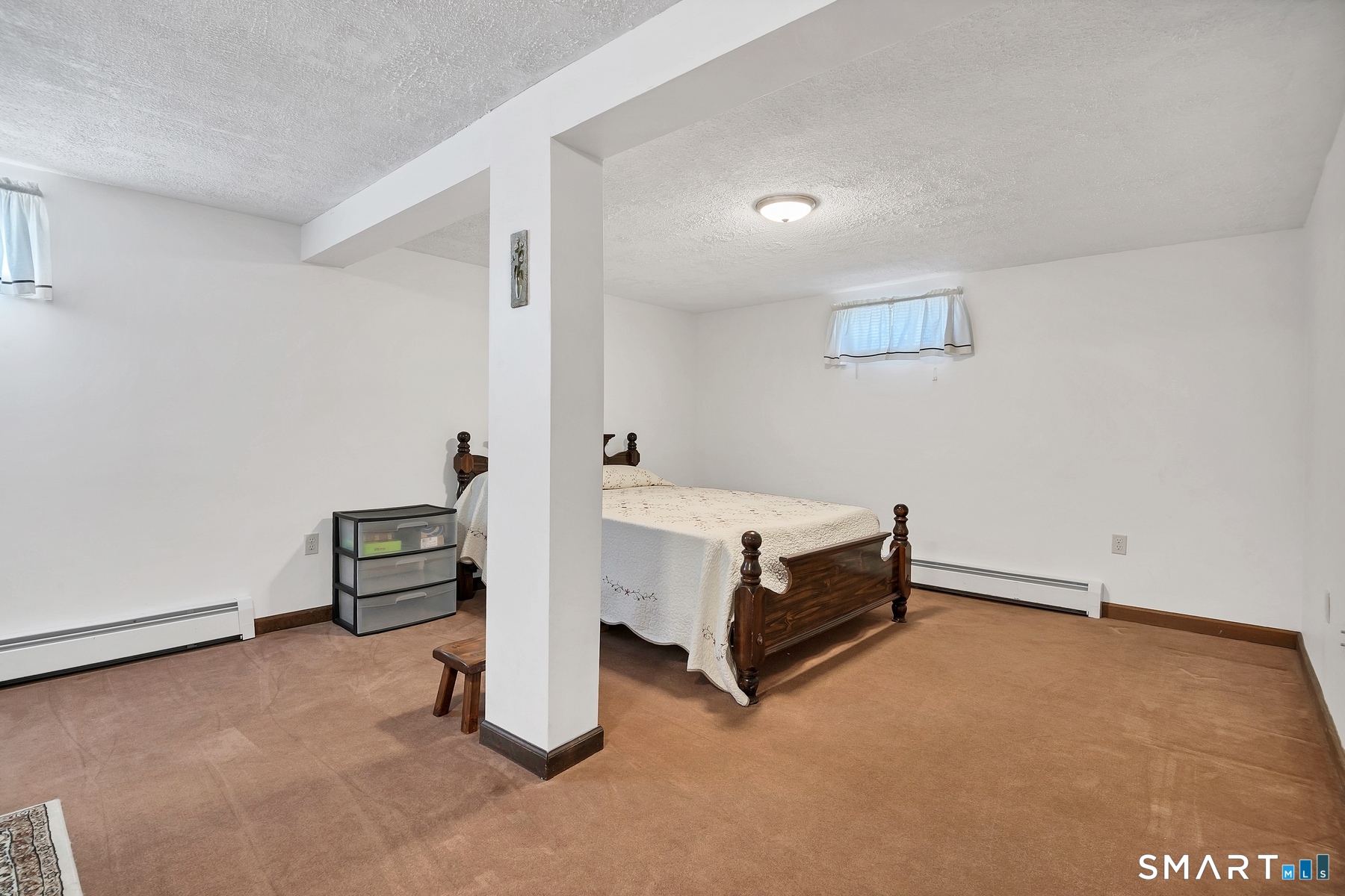 110 Meadow Lark Road Naugatuck, CT 06770 - Photo 17 of 40 an empty room with a workbench