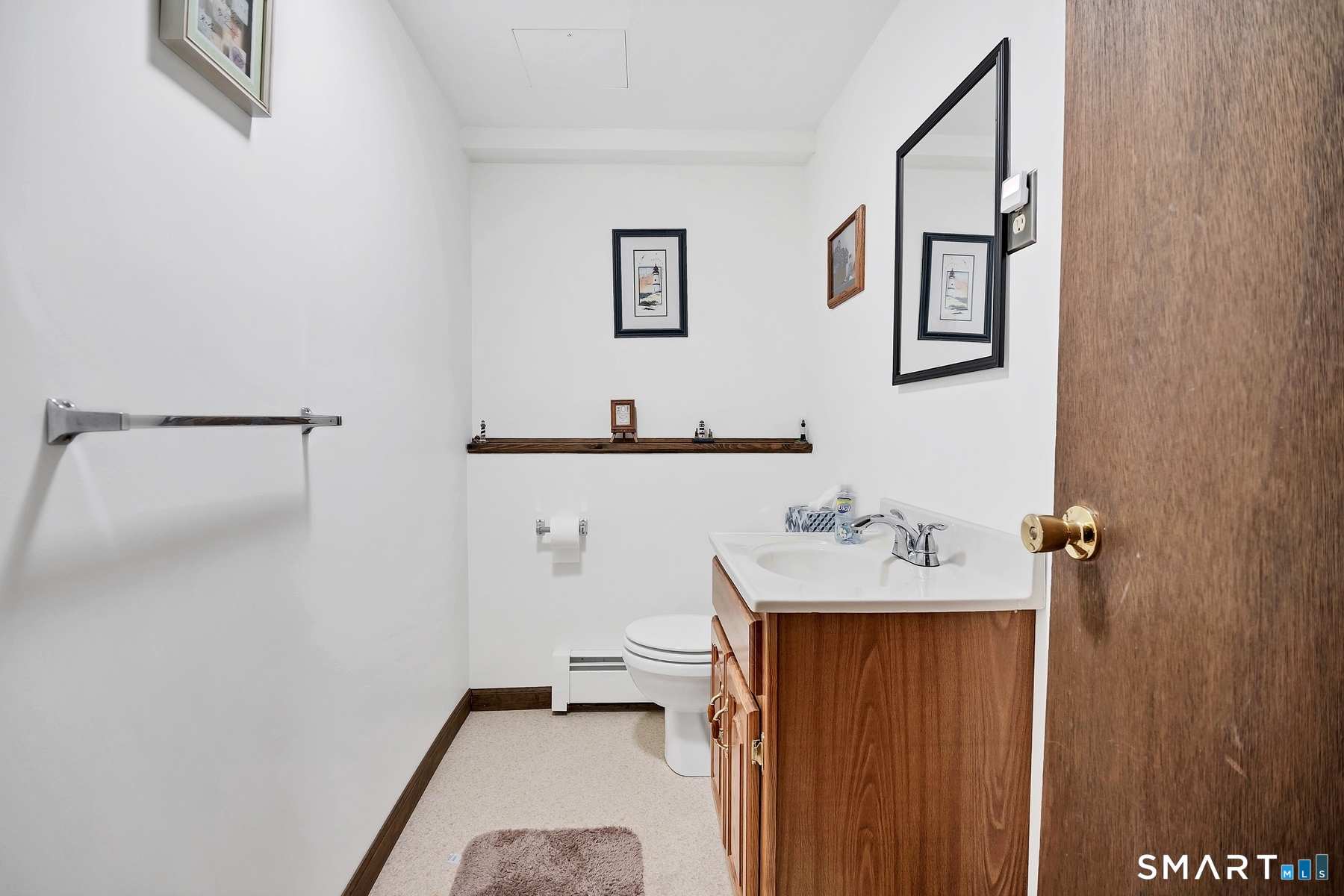 110 Meadow Lark Road Naugatuck, CT 06770 - Photo 19 of 40 a bathroom with a sink and mirror