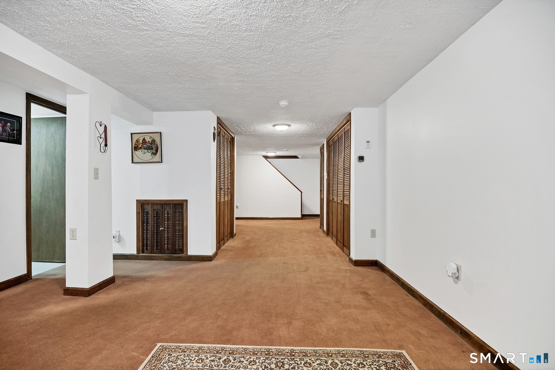 110 Meadow Lark Road Naugatuck, CT 06770 - Photo 20 of 40 a view of a livingroom with an empty space and a fireplace