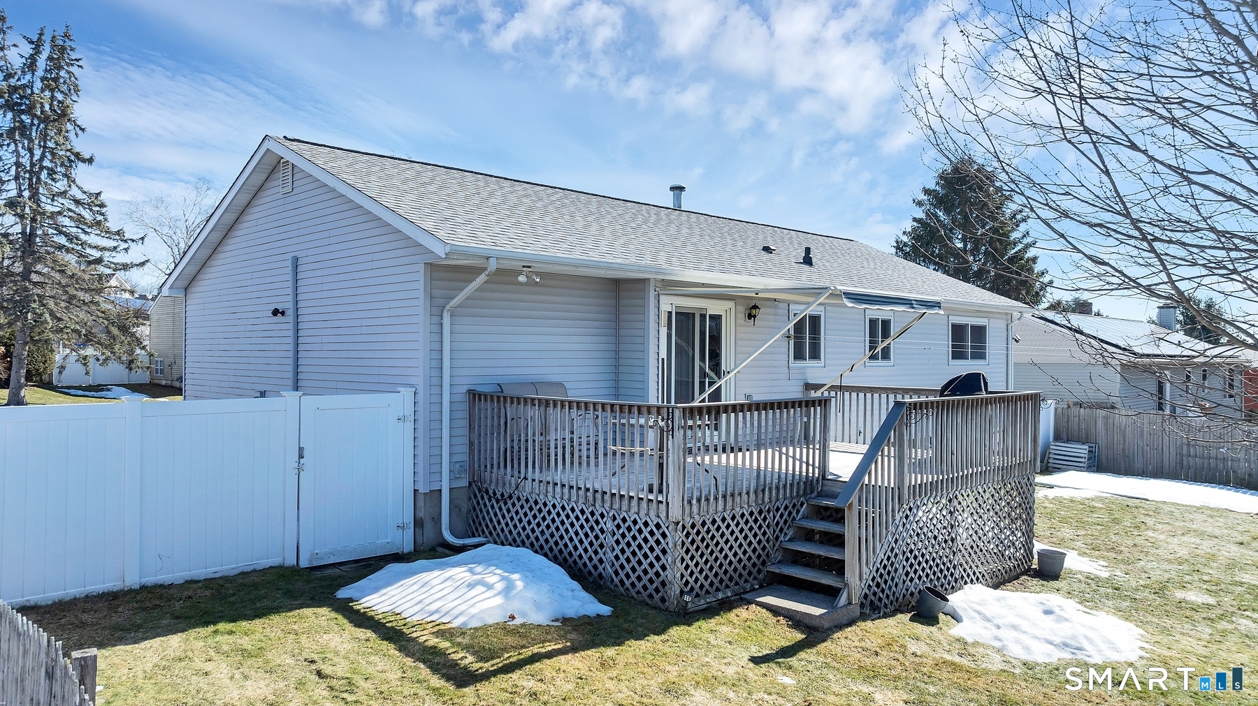 110 Meadow Lark Road Naugatuck, CT 06770 - Photo 26 of 40 a view of a wooden house with a small yard and wooden fence