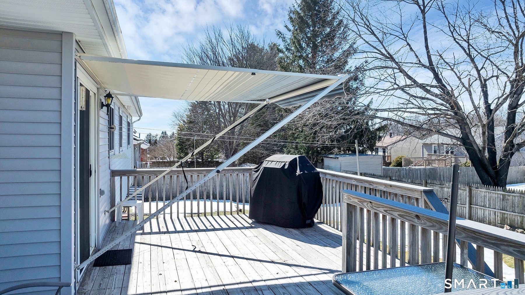 110 Meadow Lark Road Naugatuck, CT 06770 - Photo 29 of 40 a view of balcony with wooden floor and fence and a bench
