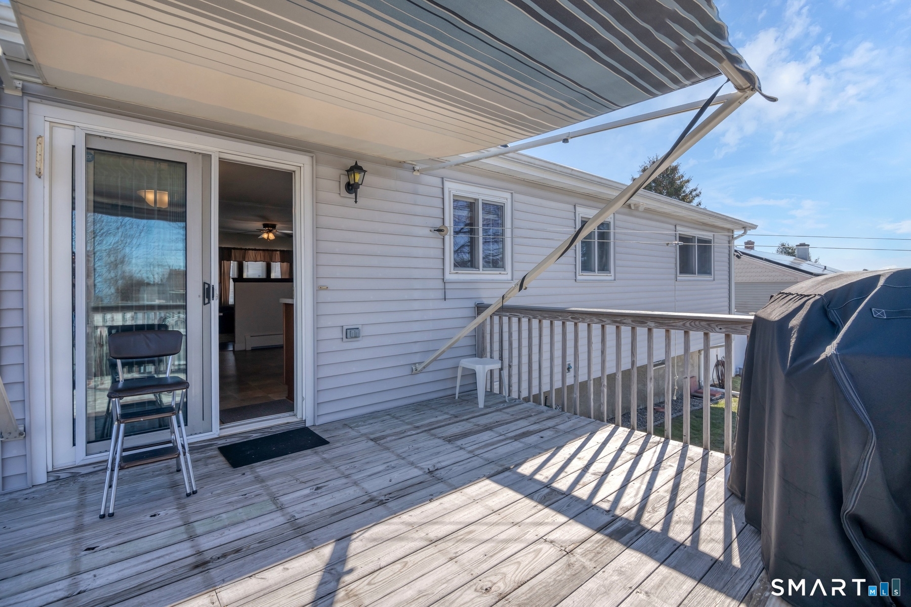 110 Meadow Lark Road Naugatuck, CT 06770 - Photo 31 of 40 a view of a house with wooden deck