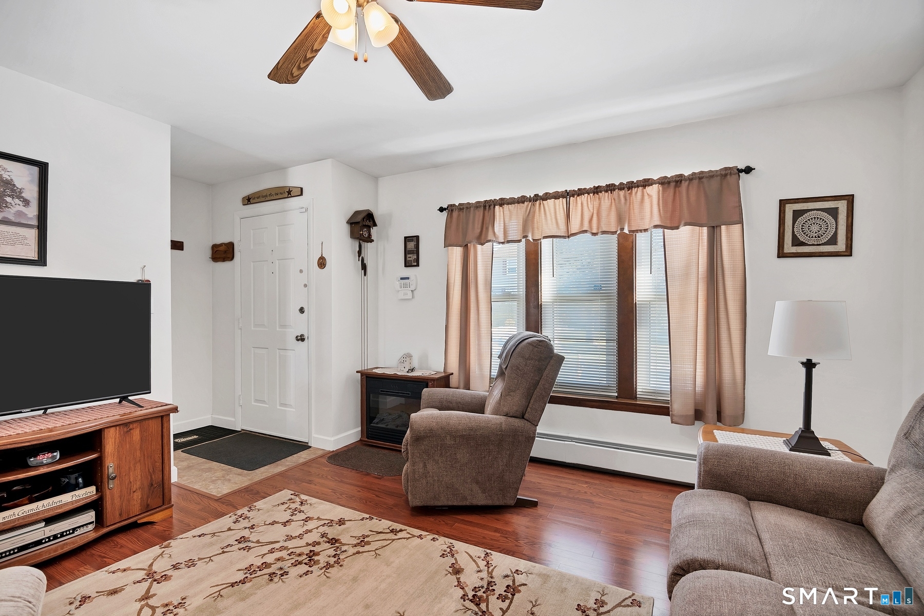 110 Meadow Lark Road Naugatuck, CT 06770 - Photo 6 of 40 a living room with furniture and a flat screen tv