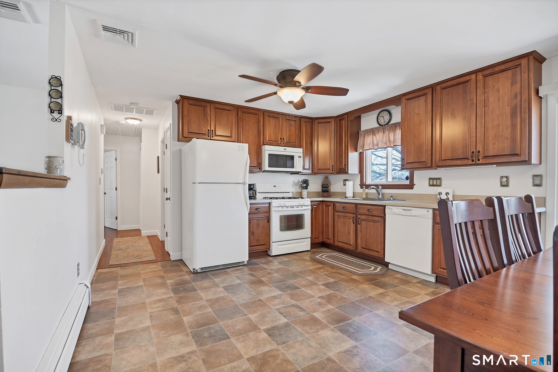 110 Meadow Lark Road Naugatuck, CT 06770 - Photo 7 of 40 a kitchen with a refrigerator a stove top oven a sink and cabinets