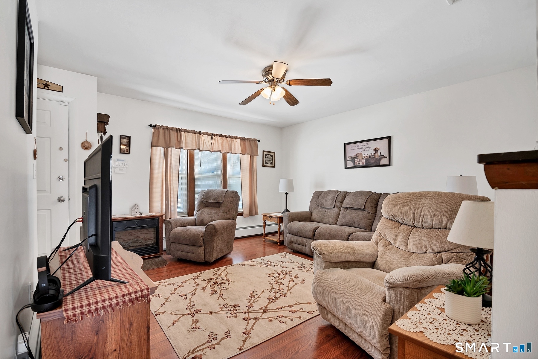 110 Meadow Lark Road Naugatuck, CT 06770 - Photo 8 of 40 a living room with furniture ceiling fan and a window