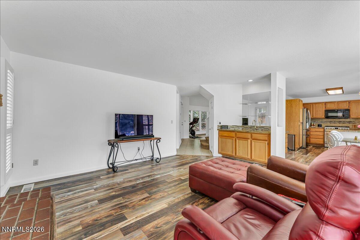 10 Eagle Claw Court Reno, NV 89523 - Photo 14 of 36 a living room with furniture and a flat screen tv