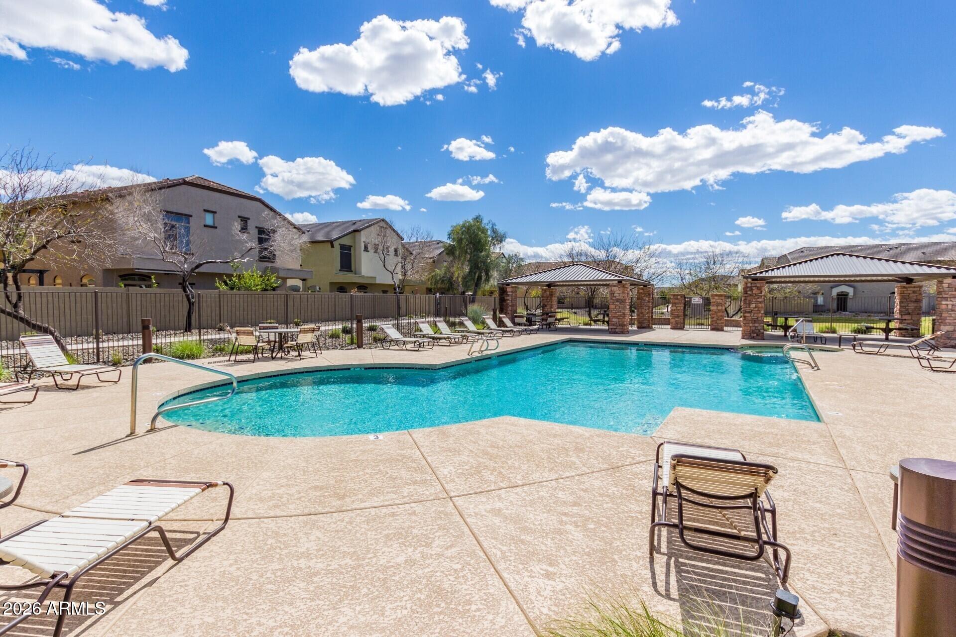2725 East Mine Creek Road, Unit 2172 Phoenix, AZ 85024 - Photo 26 of 28 a view of a house with a swimming pool