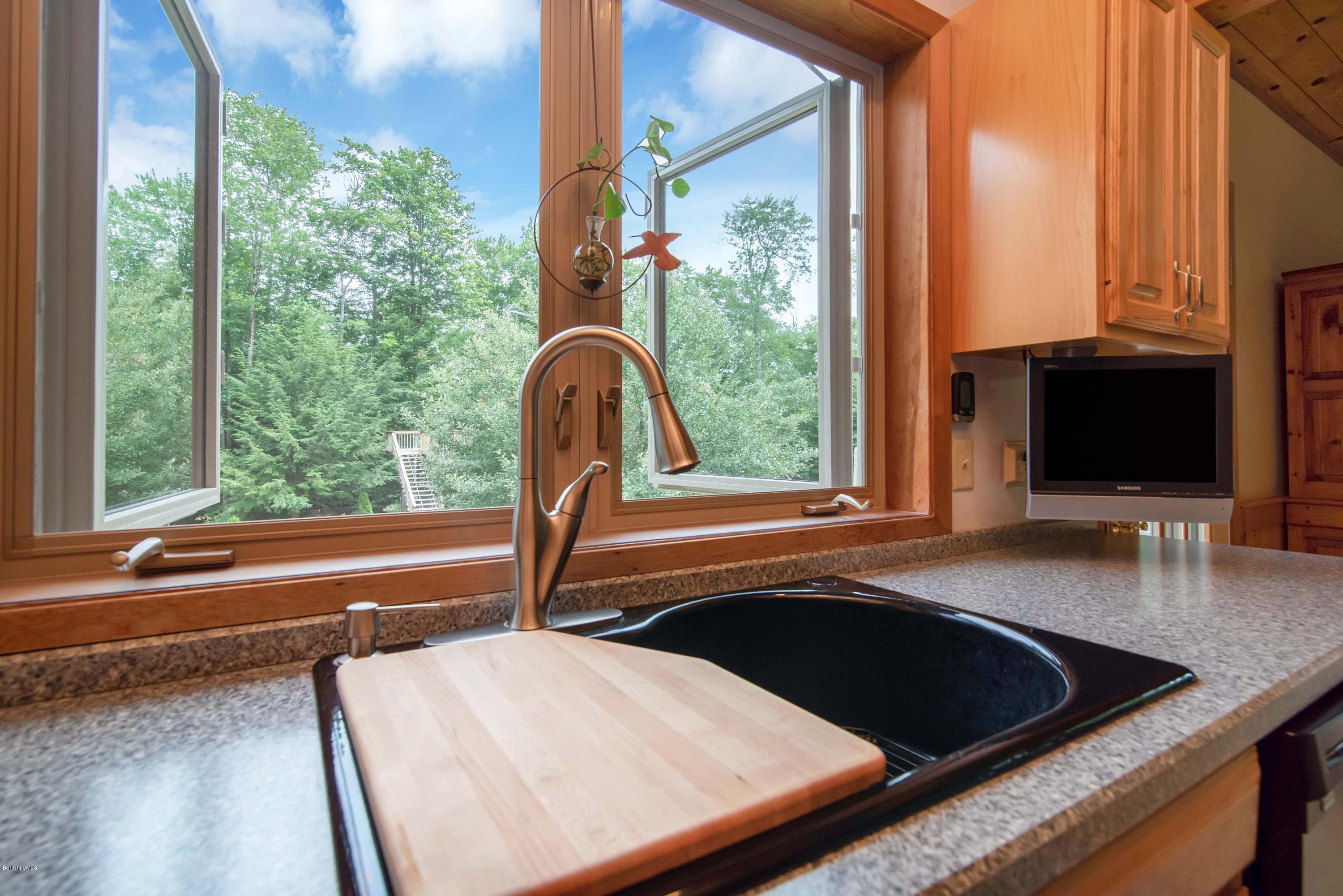106 Dimmock Road Otis, MA 01253 - Photo 13 of 42 a view of a large window with a kitchen view