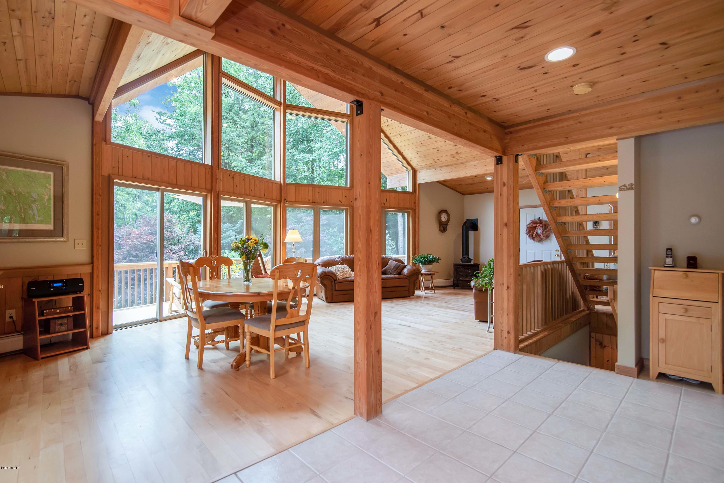 106 Dimmock Road Otis, MA 01253 - Photo 14 of 42 a dining room with furniture water view and large windows