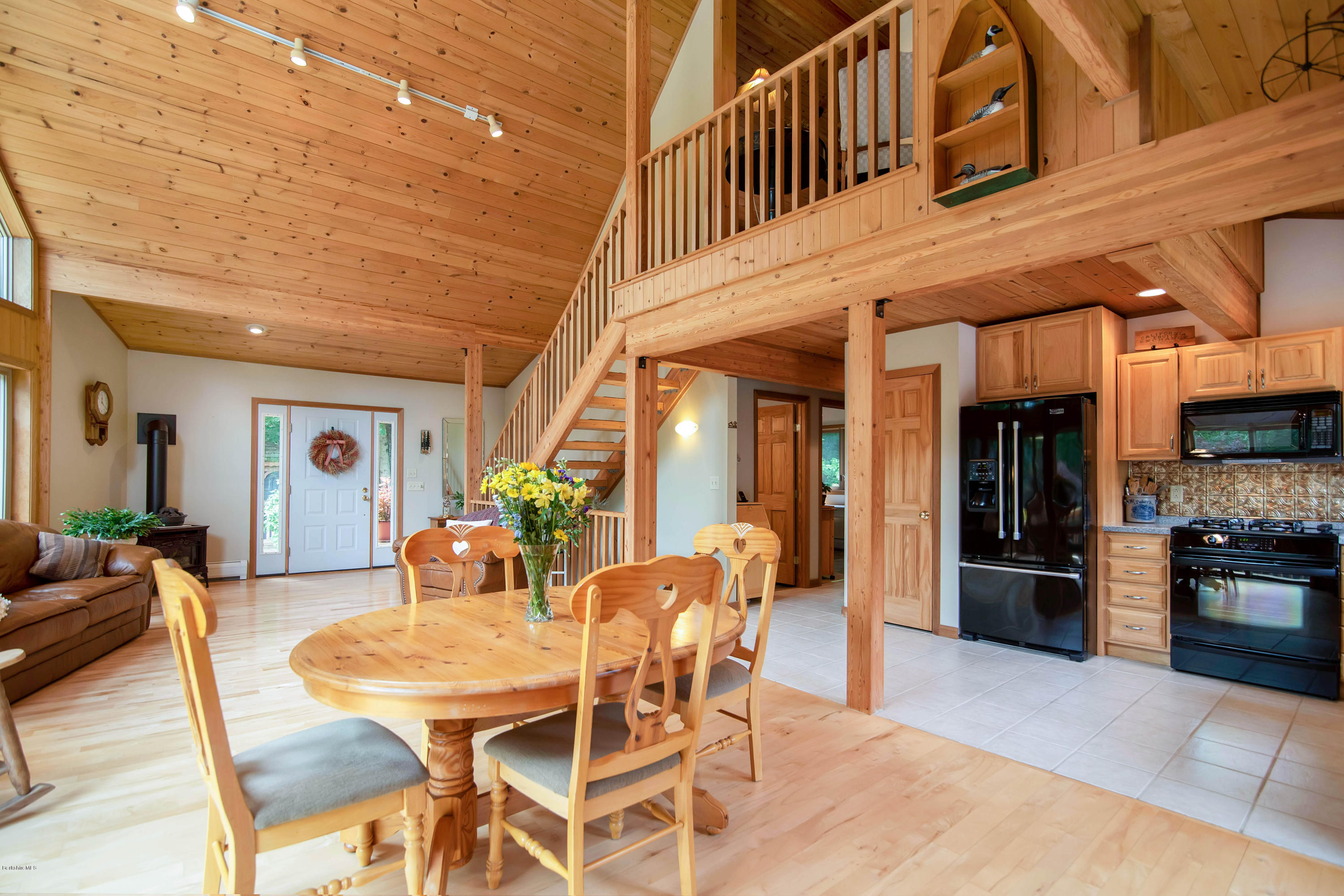 106 Dimmock Road Otis, MA 01253 - Photo 15 of 42 a dining room with furniture and a kitchen