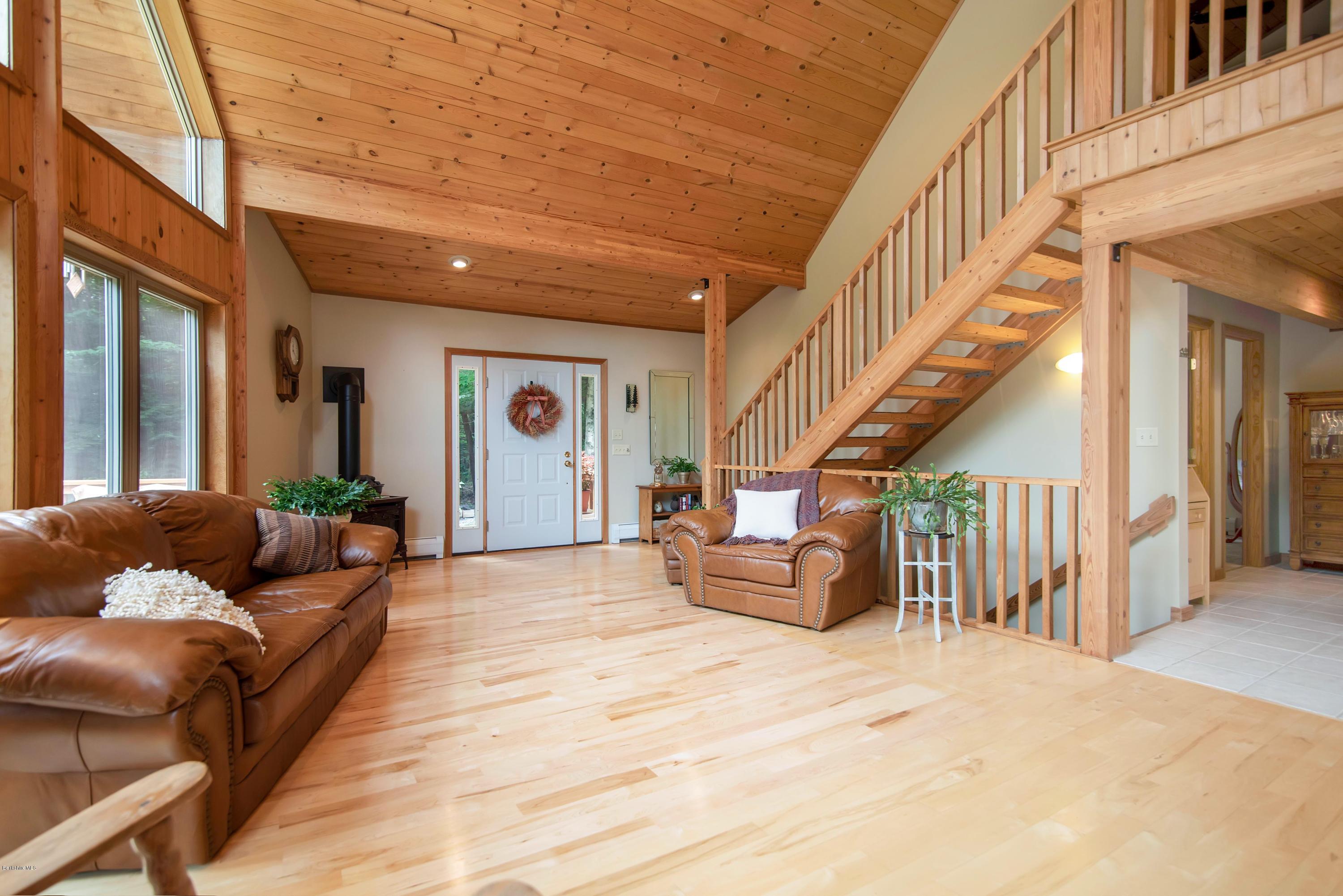 106 Dimmock Road Otis, MA 01253 - Photo 16 of 42 a living room with furniture and stairs