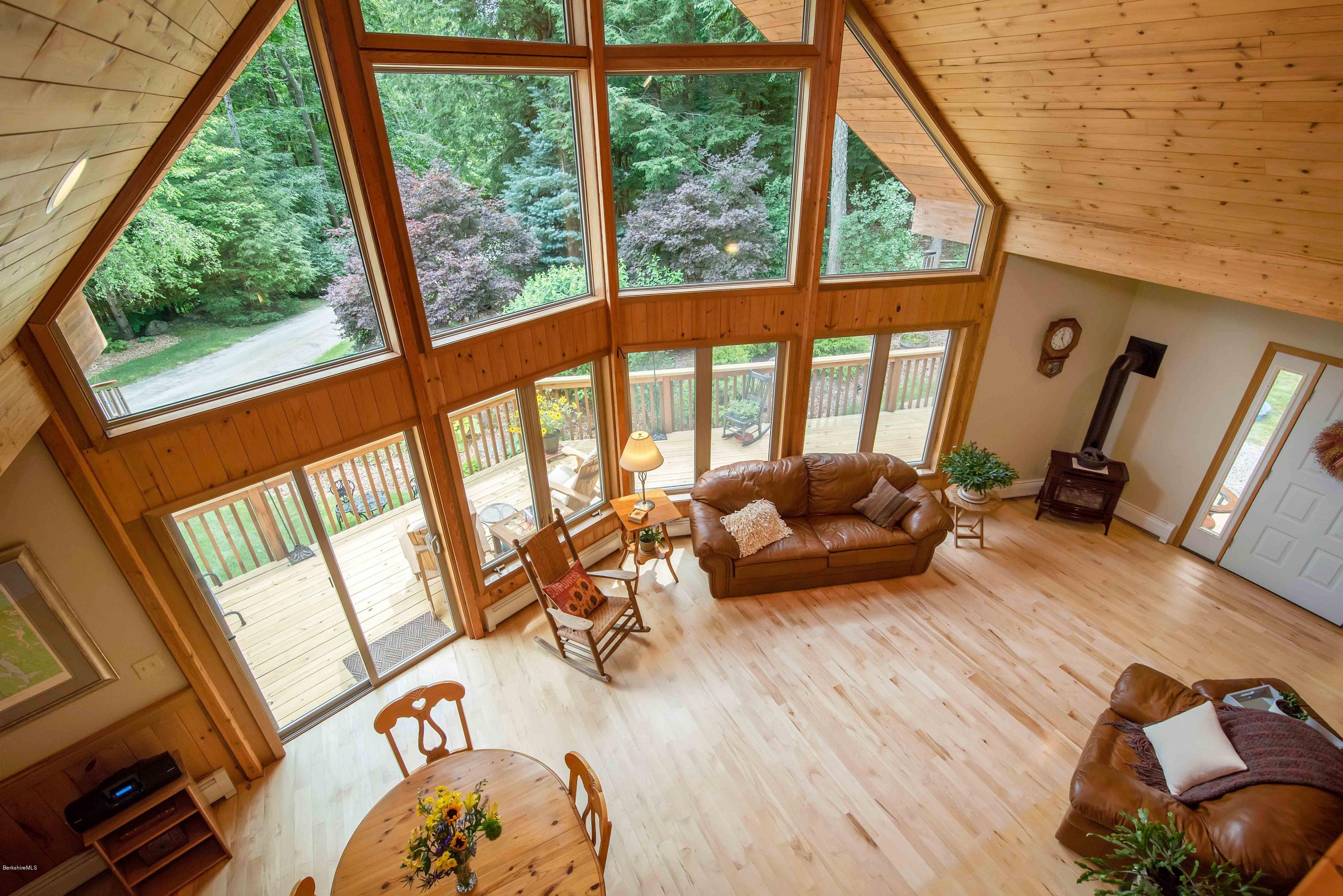106 Dimmock Road Otis, MA 01253 - Photo 19 of 42 a living room with furniture and a large window