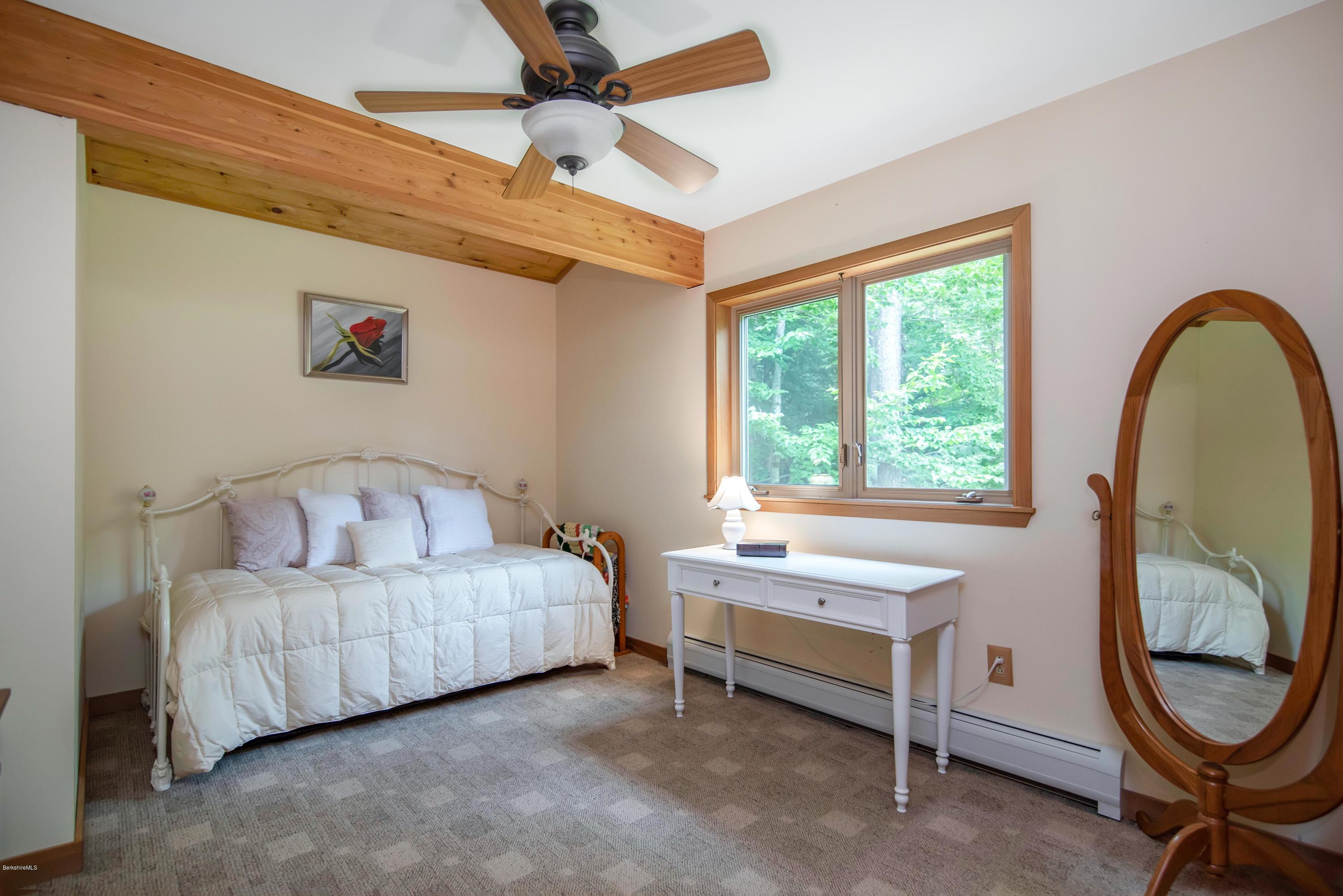 106 Dimmock Road Otis, MA 01253 - Photo 24 of 42 a living room with furniture and a window