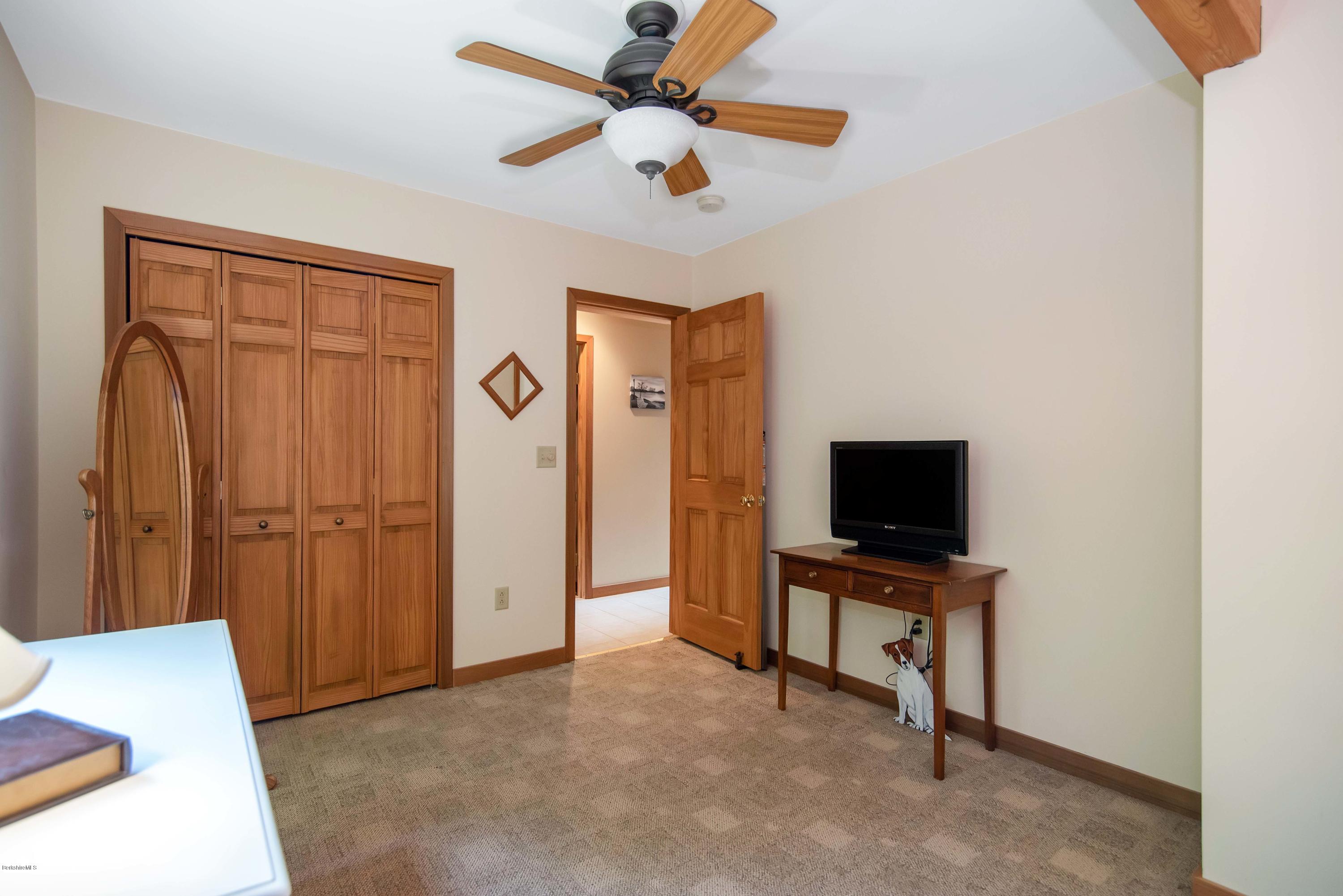 106 Dimmock Road Otis, MA 01253 - Photo 25 of 42 a view of work space with hardwood floor and a ceiling fan