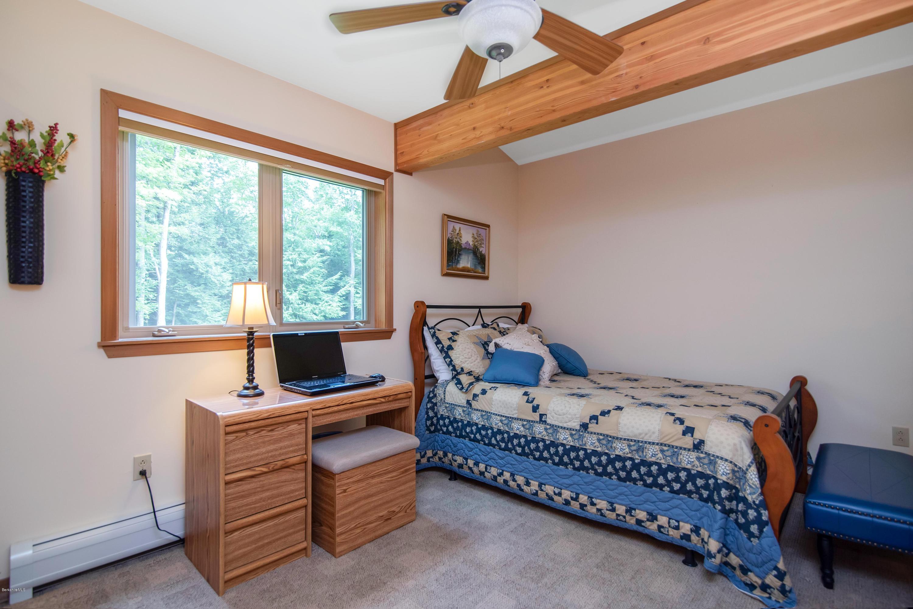 106 Dimmock Road Otis, MA 01253 - Photo 26 of 42 a bedroom with a bed and a window