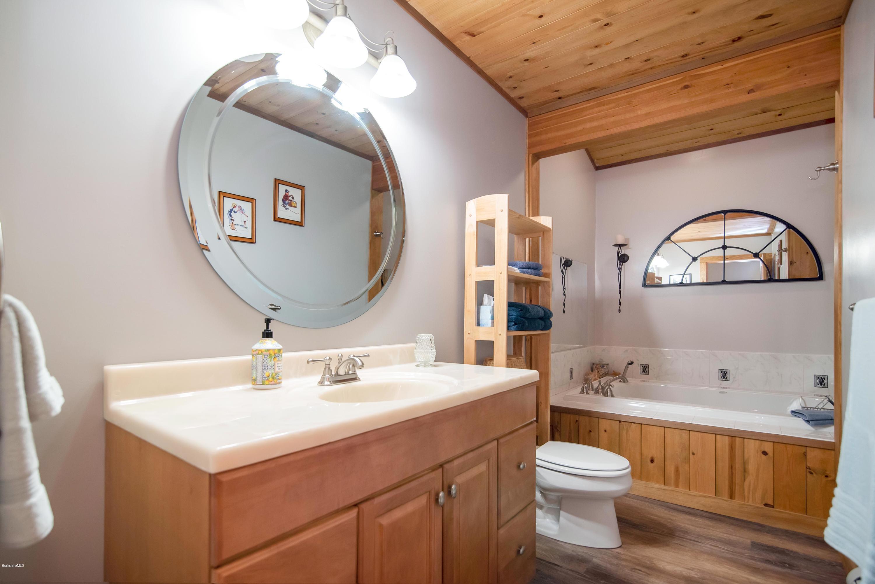 106 Dimmock Road Otis, MA 01253 - Photo 28 of 42 a bathroom with a sink mirror and toilet