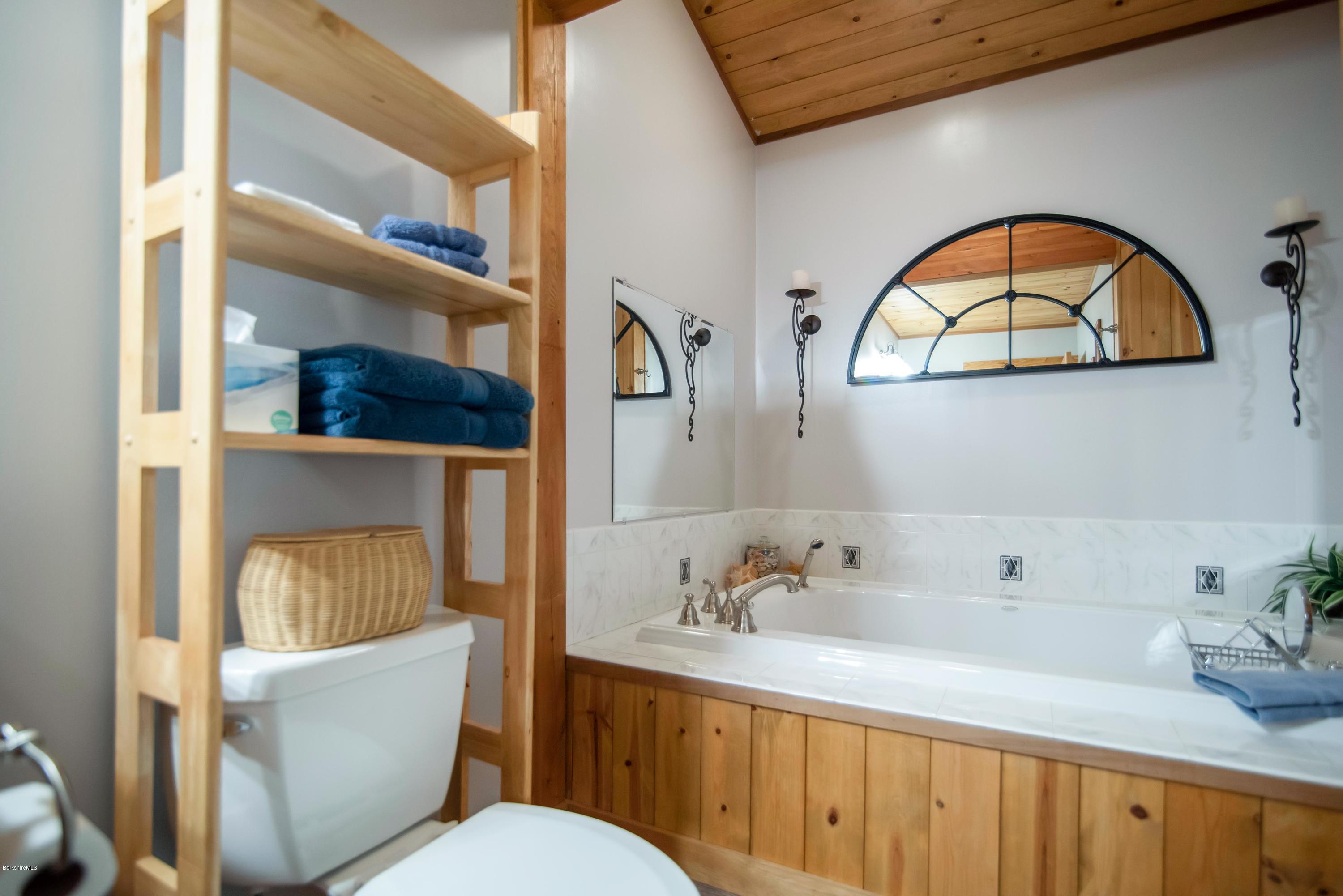 106 Dimmock Road Otis, MA 01253 - Photo 29 of 42 a bathroom with a sink and a mirror