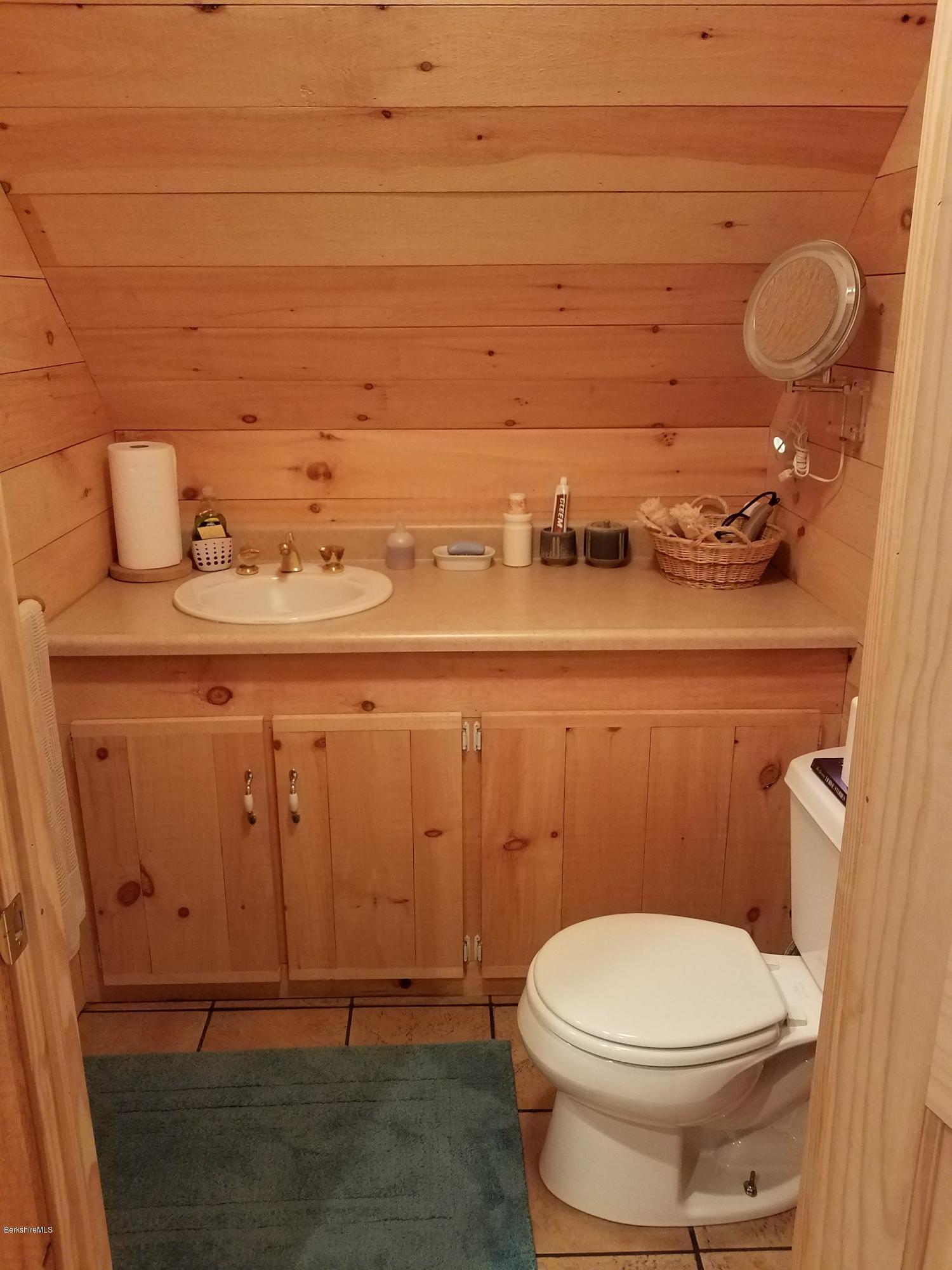 106 Dimmock Road Otis, MA 01253 - Photo 38 of 42 a bathroom with a toilet and a sink