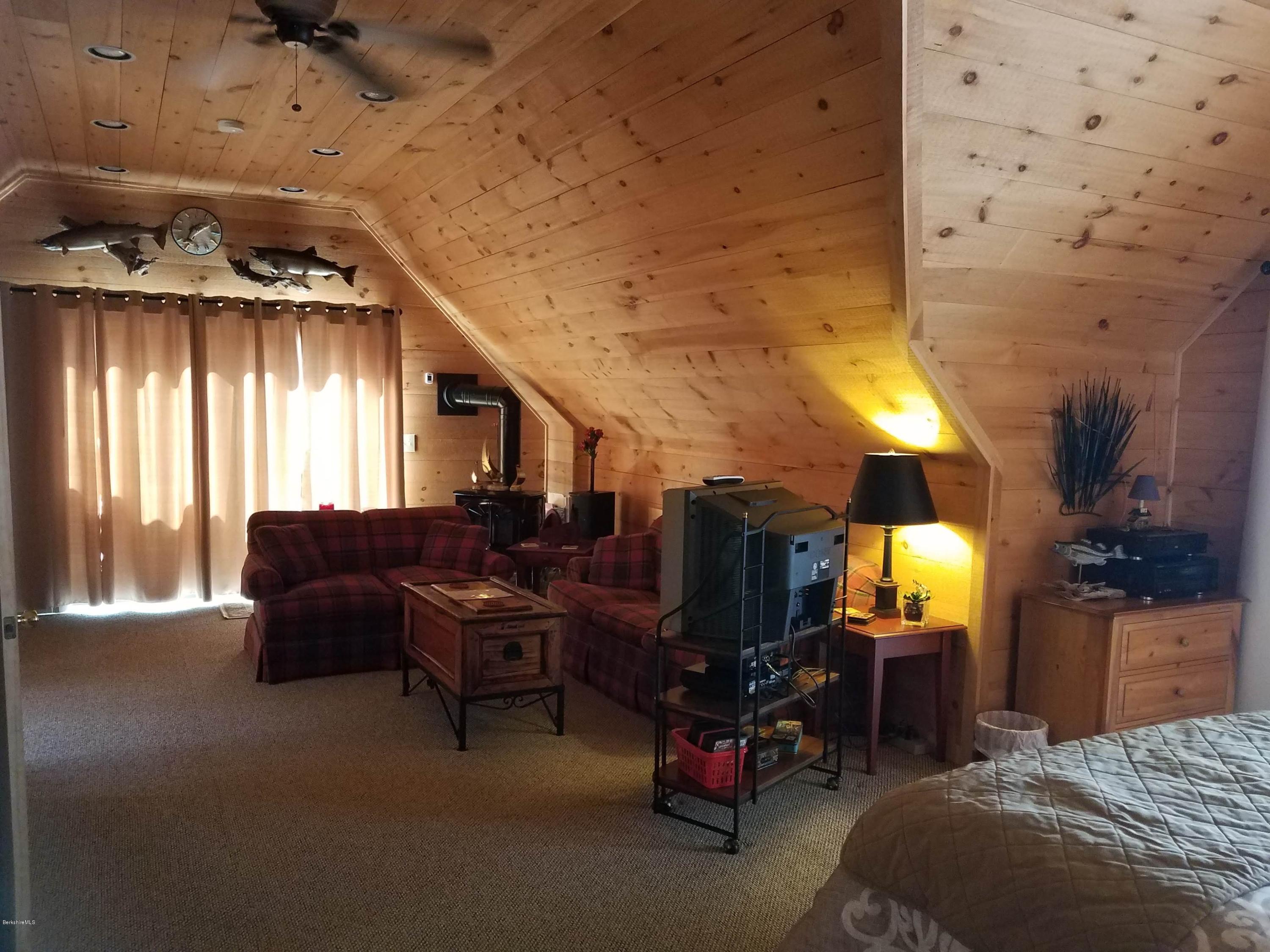 106 Dimmock Road Otis, MA 01253 - Photo 39 of 42 a bedroom with furniture and a window