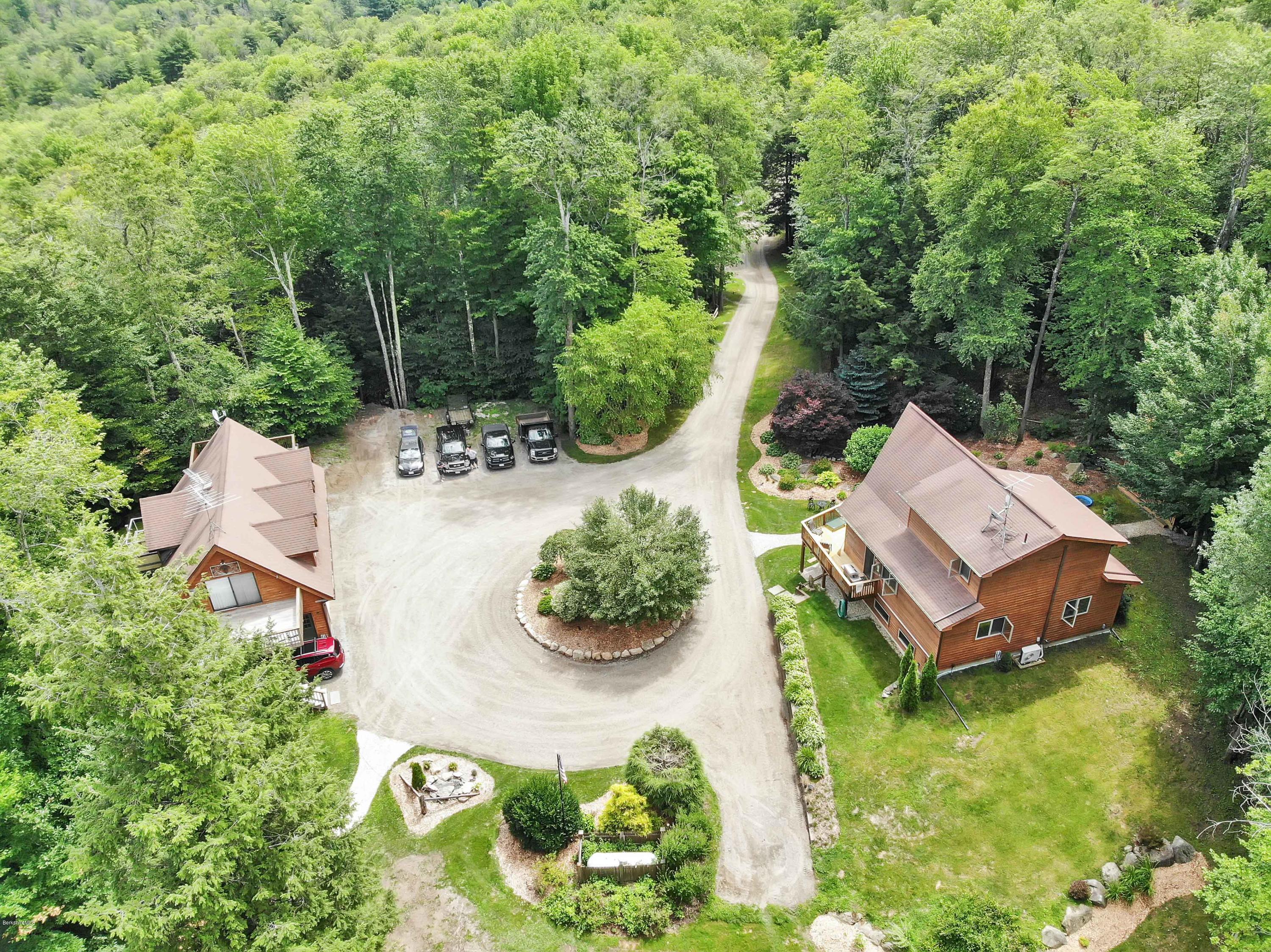 106 Dimmock Road Otis, MA 01253 - Photo 5 of 42 an aerial view of a house with garden space and street view