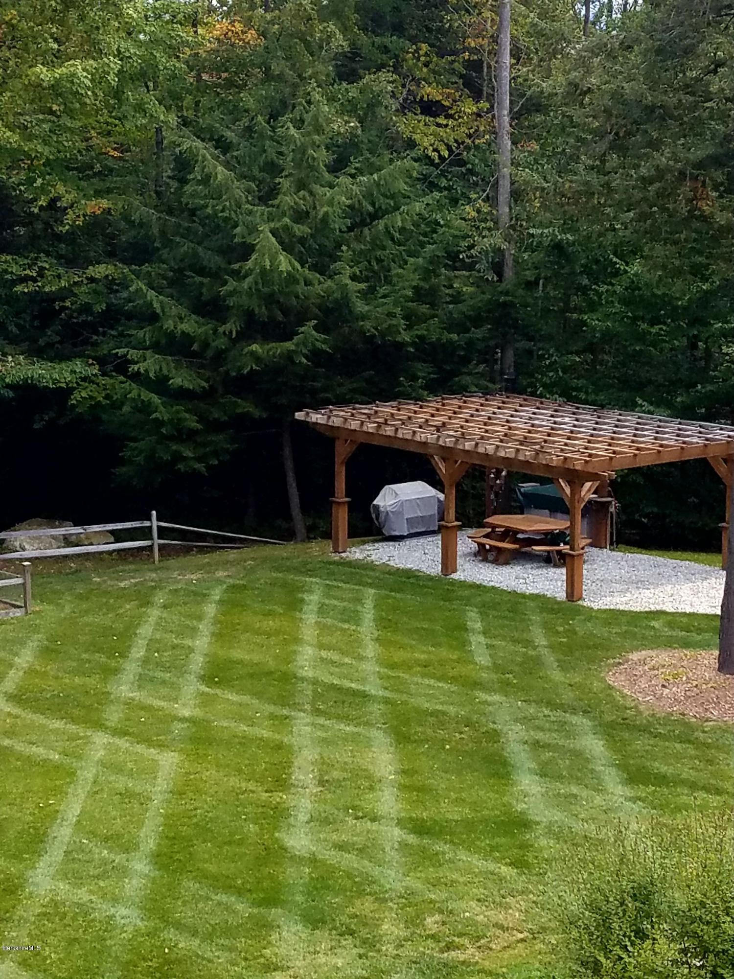 106 Dimmock Road Otis, MA 01253 - Photo 42 of 42 a view of a swimming pool with a yard