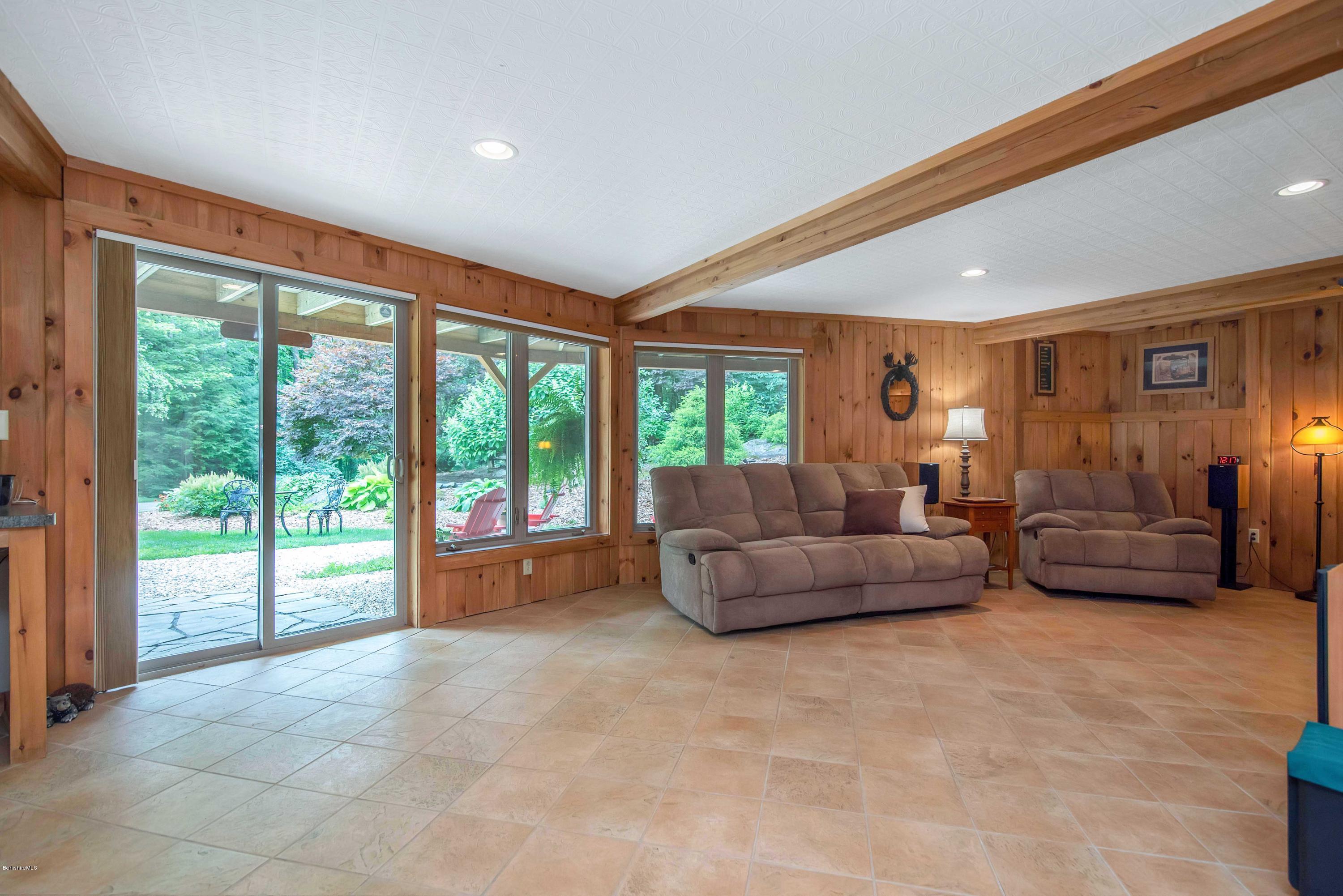 106 Dimmock Road Otis, MA 01253 - Photo 7 of 42 a living room with furniture and a large window
