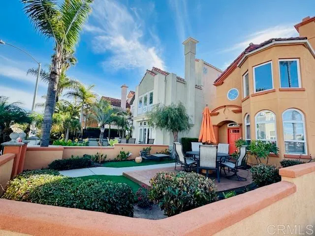 a front view of a house with a garden and a yard