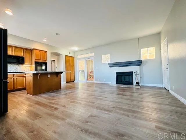 a view of kitchen with a sink and a fireplace
