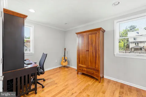 a view of room with furniture and wooden floor